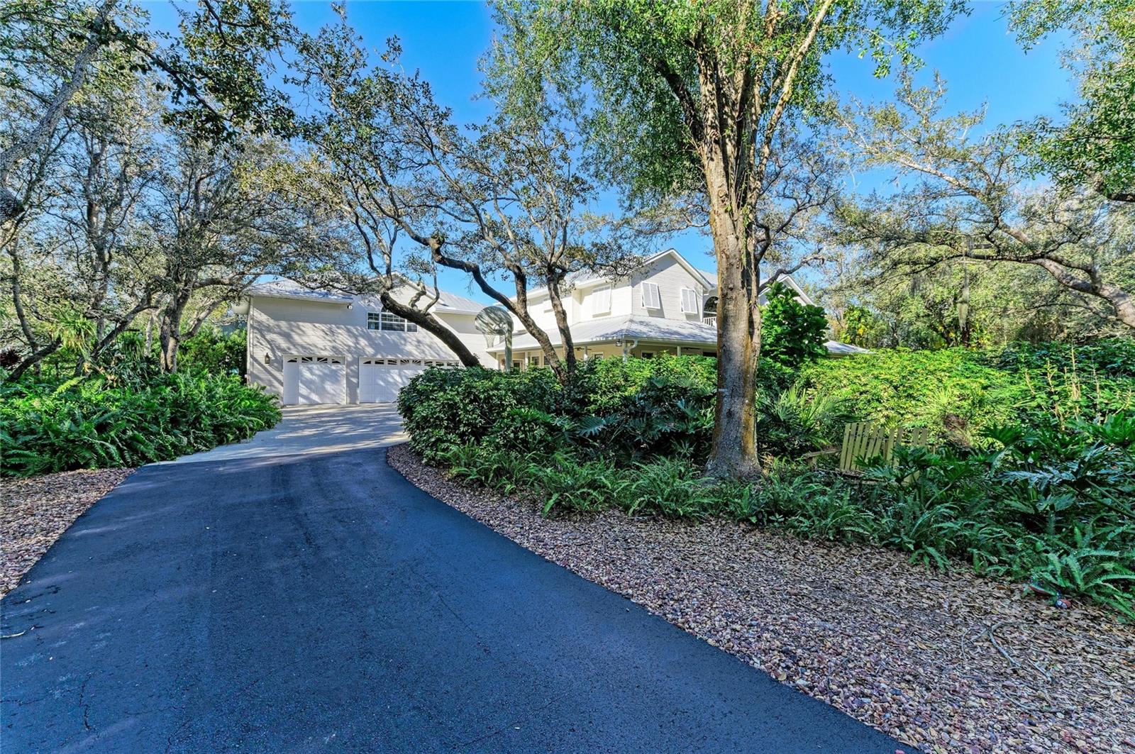 Welcome to a truly rare country estate where privacy, luxury, and nature converge.

Tucked behind a private gated entrance, a winding driveway framed by majestic heritage oaks and lush, manicured landscaping sets the tone for this custom-built, one-owner estate spanning over 10 pristine acres. This is more than a home—it’s a private retreat designed for those who value space, craftsmanship, and tranquility.

Built to last with a durable metal roof, full hurricane protection including newer impact sliding doors, the residence offers 5 full bedrooms and expansive living spaces ideal for both everyday comfort and unforgettable gatherings. The living room features a stone wall gas fireplace and is open to the kitchen and dining area. The chef's kitchen is at the heart of the home featuring stainless steel appliances, a built-in oven, an ice maker, wine storage, and an oversized granite island that anchors the space—perfect for entertaining, casual dining, and hosting holidays with ease.

The 3-car attached garage is complemented by an additional detached garage, providing ample room for vehicles, equipment, or hobbies. All garages have dedicated electric with room to expand the electric service if you desire. There is also a generator plug in the main garage and a Yamaha Generator is included! 

Wellness and relaxation take center stage with a dedicated exercise room featuring a sauna and tanning bed, while outdoors, the heated and cooled pool invites year-round enjoyment in a serene, resort-like setting.

Nature lovers and boating enthusiasts will appreciate permitted access to Shell Creek, with the ability to add a dock, opening the door to peaceful waterfront moments, kayaking, fishing, and scenic exploration.

From the gated arrival to the creekside possibilities, this exceptional estate offers the perfect balance of country charm, privacy, and modern luxury—a once-in-a-lifetime opportunity to own a legacy property.

Private. Custom. Unforgettable. *BE SURE TO ASK FOR THE FULL FEATURE SHEET*