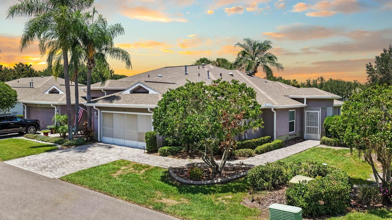 Every day could feel like a vacation in this well-maintained, MOVE-IN READY, 2-bed + FLEX SPACE, 2-bath, 2-car attached garage home for sale in the resort-style 55+ community of Kings Point! NEWER ROOF (2024) & AC (2025), mature landscaping with STAMPED CURBING, PAVER DRIVEWAY, pull-down screen on garage door, SCREENED/COVERED FRONT PORCH, ENCLOSED FLORIDA ROOM, archways throughout, PLANTATION SHUTTERS, high ceilings, SKYLIGHTS, and more. The foyer welcomes you into this OPEN CONCEPT Cimarron floor plan, where you'll find beautiful ENGINEERED HARDWOOD flooring in the combined living/dining area as well as in the flex space that could be used as a formal dining room, office, or den! The kitchen features a GAS RANGE, bistro dinette space, and a BREAKFAST BAR. Situated between the living room and Florida Room is yet another flex space, with FRENCH DOORS leading to the enclosed lanai built for year-round enjoyment. The Primary Suite has TWO WALK-IN CLOSETS and an EN-SUITE BATH, and the secondary bedroom is conveniently located near the second full bathroom for a comfortable guest stay. Even the laundry room aims to please with its built-in shelving, linen closet, and washer/dryer. Kings Point is a bustling gated and golf cart friendly community known for a myriad of recreational facilities, indoor/outdoor heated pools, a state-of-the-art fitness center, arts, crafts, tennis, pickle-ball, lawn bowling, auditorium with 800+ seating and over 200 clubs & activities. Don't miss this great opportunity; schedule your showing today!