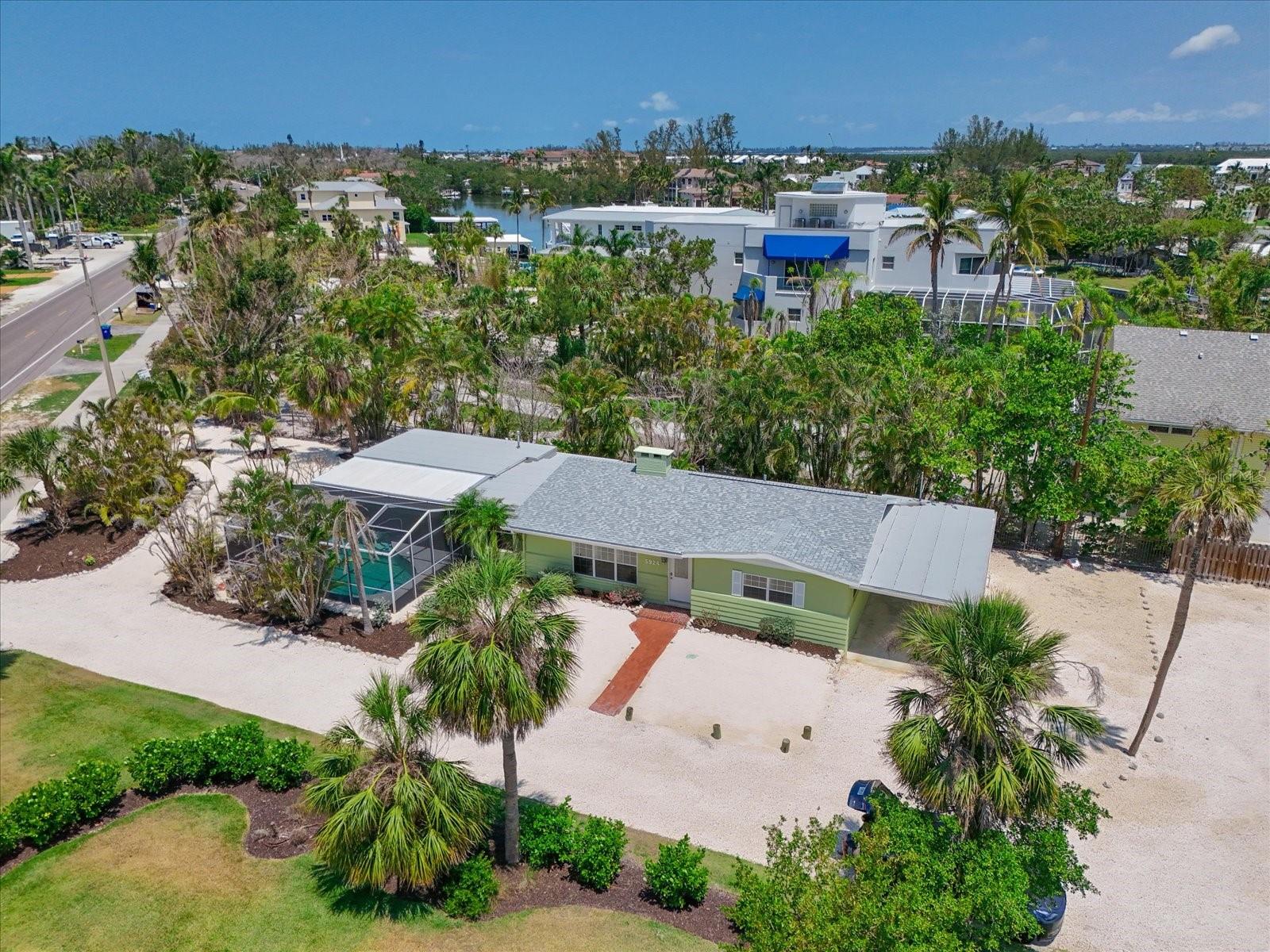 Sought after mid-key cottage home with DEEDED BEACH ACCESS on the barrier island of Longboat Key.  Entering the home, you are greeted by terrazzo floors, wood beam ceilings and a tile accented gas fireplace in the large living room.  An additional room overlooking screened in pool can be used as an office, exercise room or extra space for guests. Newly renovated kitchen with wood cabinets, quartz countertops, new sink and fixtures.  Bathrooms have been completely renovated with beautiful walk-in tiled showers. A built-in bookcase in the living room adds charm with plantation shutters, accent lighting and ceiling fans throughout.  

Completely restored home by licensed general contractor and professionally mitigated after hurricane Helene flood damage.  The house shares a driveway and deeded beach access with 5920 Gulf of Mexico Drive making it a perfect guest house or family compound when purchased together.  Another possibility is to use one as as a rental for an ongoing revenue stream.  The property is being sold As-Is (use FAR-BAR-ASIS-7.