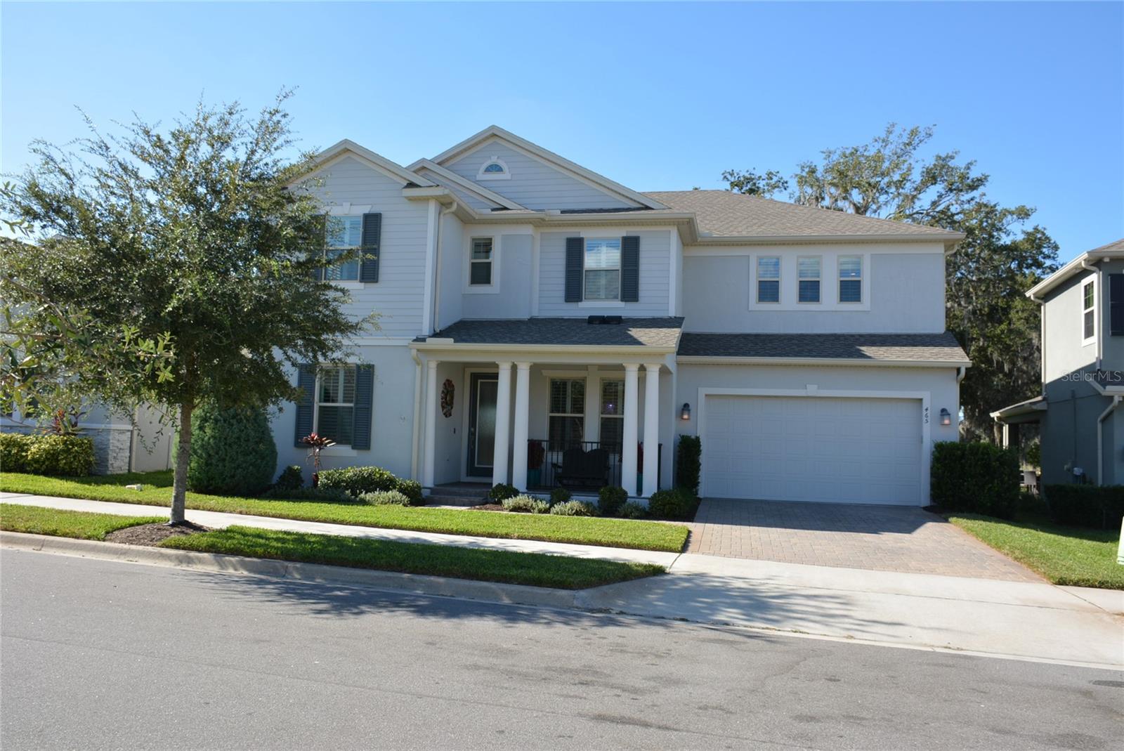 Water View * Brick paver courtyard entry * 3 car, climate controlled, tandem garage * Enter this gracious (plantation shutters throughout) two-story home with abundant natural light through a covered porch with pavers & decorative columns * A single light French door brings you into the foyer with line-of-sight to the lake! * Enter the foyer on wide plank wood look ceramic tile flooring which runs throughout the main level - making this large home with 9’ ceilings feel even more spacious!  Formal living and dining areas located off the foyer * Kitchen with informal eating area overlooks family room and covered lanai * Spacious Kitchen includes generous center island with grey quartz countertops and double basin undermount sink * Abundant countertops, white cabinetry with 42” uppers, dramatic glass tile backsplash rising around the hood, convection cooking with built-in oven and microwave, glass cooktop, Stainless Steel GE appliances including French door refrigerator with in-door dispenser - SS KitchenAid dishwasher (less than a year old), coffee bar and step-in pantry with custom shelving * Large family room with oversize triple sliders leads to the lanai (with retractable screening) and pergola with pavers overlooking large backyard with custom landscaping * Guest half bath and laundry area complete the main floor living * A switchback stairway leads from the foyer to a large (18x17) loft/bonus room * Master retreat foyer provides privacy and leads to a spacious (20x16) light & bright master bedroom with tray ceiling and triple windows providing an expansive and peaceful view of the lake, backyard and walking trails * Double walk-in closets with auto on/off lights * Master bath has dual vanities, an oversize garden tub, large step-in shower, private water closet and wide plank ceramic tile flooring * 3 guest rooms include a large (14x12) second bedroom with ensuite bath * 3rd & 4th bedrooms share a Jack & Jill bath featuring grey quartz vanity with dual undermount sinks and wide plank ceramic tile floors * 3rd bedroom has a walk-in closet (for additional storage) which leads to the mechanical closet for HVAC & RUKUS hub * Main level laundry area (with dual sets of double upper cabinets for additional storage) leads to 3 car tandem (2 car space - 20x20’ * 1 car 18x11’) garage which is climate controlled and equipped with New Age workbench and cabinetry (approximately 18 ft long) including four 7’ double wide storage cabinets, an absolute dream set-up for anyone craving organized working conditions - comfortable year round * GDO, new within the past year * 17 x 12’ covered lanai with retractable screens and brick pavers overlooks an open area (17x13) with pergola and pavers * Energy efficient windows for low electric bills * Programable, Smart Home with WAN & 2 Wireless Access Points and * Whole house water softener *  Tuskawilla Crossings recreational amenities, include community walking path around the lake, benches overlooking the water, neighborhood access to the Cross County Seminole Trail system (just steps from the front door), community pool with plentiful open space, two fenced children's parks, dog park, picnic pavilion and tables overlooking the lake * HOA dues are approximately $120/month * Currently zoned for Layer Elementary, Indian Trails Middle and Winter Springs High School * Old Republic Home Warranty *