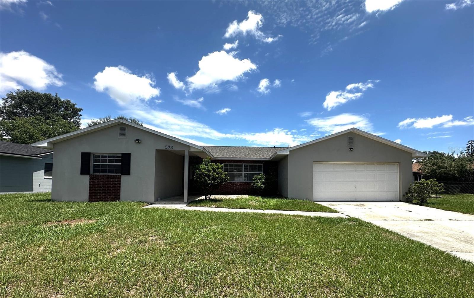 Location, Location, Location! Welcome to this charming 3-bedroom, 2 bath home located in a well-established American Heritage Estate community in the south Orlando area.  All tile floors throughout. Open living and dining rooms. Galley kitchen with new stainless smooth top stove. Kitchen open to family room. Recent updates include a new roof (2022), plumbing repiped (2023), AC (2024), Electrical Panel (2025), Water Heater (2023). ... The home is located close to 528, 5 minutes from The Florida Mall, 20 minutes to Sea World, Lake Nona, Orlando Medical City, the Orlando International Airport and I-4. About 20-30 minutes from Disney World and Disney Springs. This home is ready for a new family to call home.