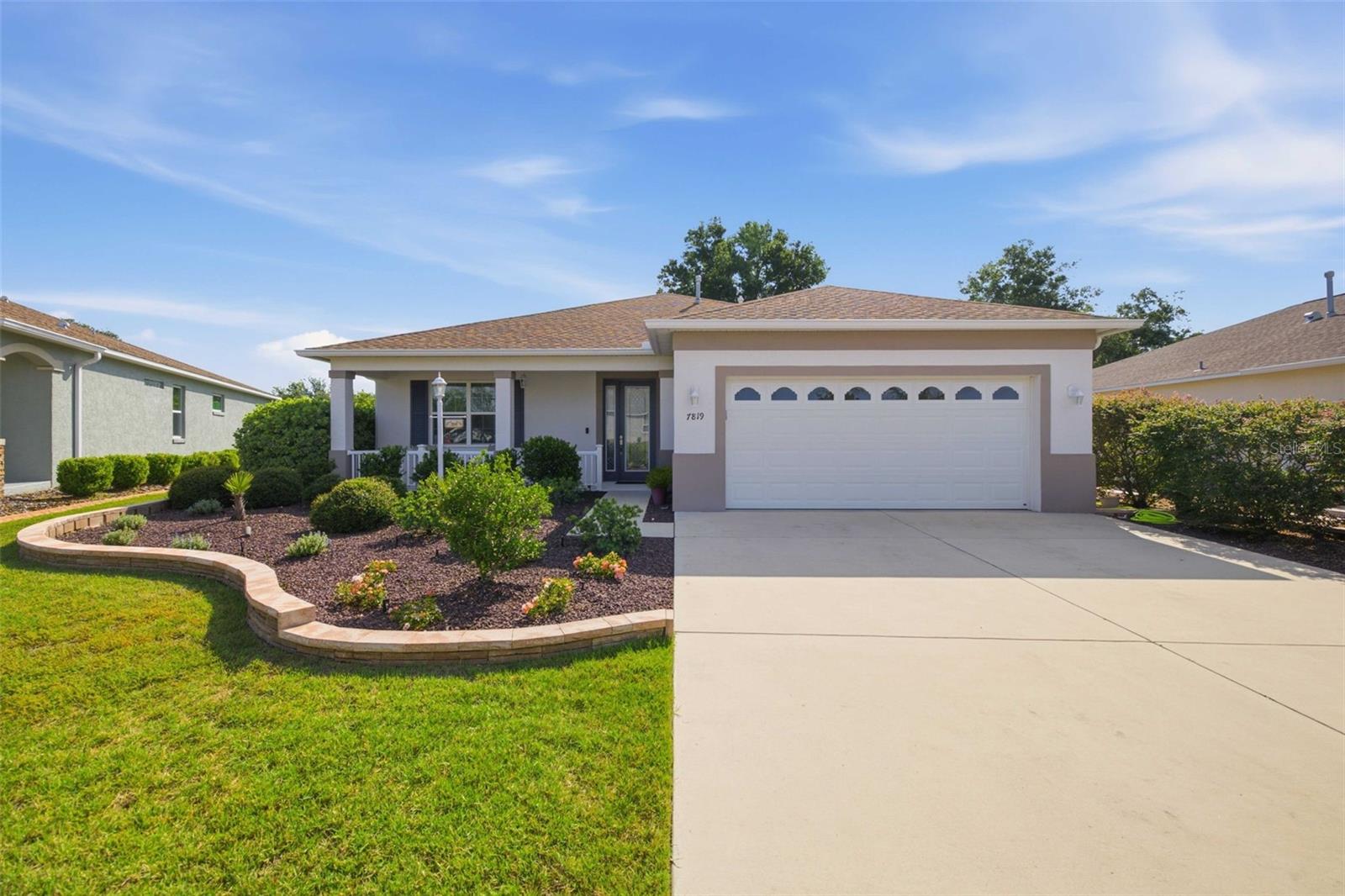 Beautifully upgraded Wisteria in Indigo East OTOW in SW Ocala! This pristine, meticulously maintained home offers an open and spacious floor plan with high ceilings, and abundant natural light. The stunning kitchen features quartz countertops, a complementary backsplash, plentiful 42" cabinetry, and an oversized L-shaped island with seating for 6–8, making it perfect for entertaining. The adjoining living area showcases a tray ceiling with crown molding, ceiling fan, recessed lighting, and an electric fireplace with heater for added comfort and ambiance. A cozy dining area sits off the kitchen, while the functional laundry room includes cabinetry, a wash tub, washer and dryer, and a stone folding counter. The oversized primary suite offers 2 large walk-in closets, dual sinks, generous storage, and a zero-entry shower. Two guest bedrooms are privately situated away from the primary suite. Enjoy peaceful views from the oversized screened lanai and extended patio overlooking a dry retention area with no rear neighbors. Additional highlights include paid-in-full, transferable solar for low energy costs, an extended garage, widened driveway for easy vehicle access, gutters, French drains, fans throughout, and an inviting extra-wide foyer. This exceptional home combines comfort, efficiency, and style in one of Ocala's premier 55+ communities.