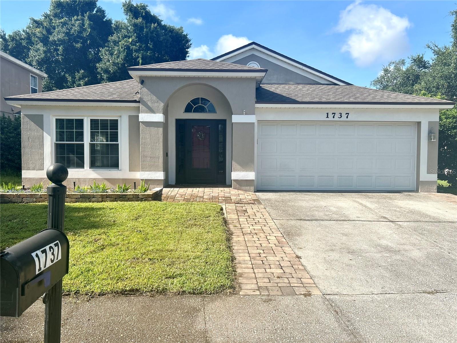 What a gem!  Inside the gated community of Oakhurst Reserve, step into this inviting single-story home to discover a spacious open living-room and dining-room combo. The first hallway to the right leads to a large primary bedroom, with an attached  bathroom and a large walk-in closet! Past the well-appointed kitchen, with ample cabinet space and modern appliances, is a second hallway to the right. This hallway leads down to three more rooms (two carpeted bedrooms, and the third bonus room), as well as a second full bathroom. Toward the back of the house is an additional entertainment room, which shares an open concept with the kitchen. Beyond that is a third hallway, with an additional two bedrooms and a third full bathroom. This home has many updates, including new windows throughout, flooring and screened in lanai all done in 2024. As well as a water heater installed in 2022, a roof in 2021, and a Lennox 23 SEER HVAC system in 2020, ensuring worry-free living for years to come. The fenced backyard offers privacy and space for outdoor activities, making it ideal for entertaining guests or simply relaxing in the sunshine. Furthermore, the property includes an 8x12 storage shed, offering 100sq/ft of storage space to keep all your lawn equipment neatly organized, ensuring that your garage remains free for parking your cars. The Rainsoft EC5 water treatment system, valued at approximately $7500, will remain with the house. This system provides added value and convenience for the new homeowners, ensuring clean and fresh water throughout the home. The home is only a few houses down the street from the beautiful community pool and playground.