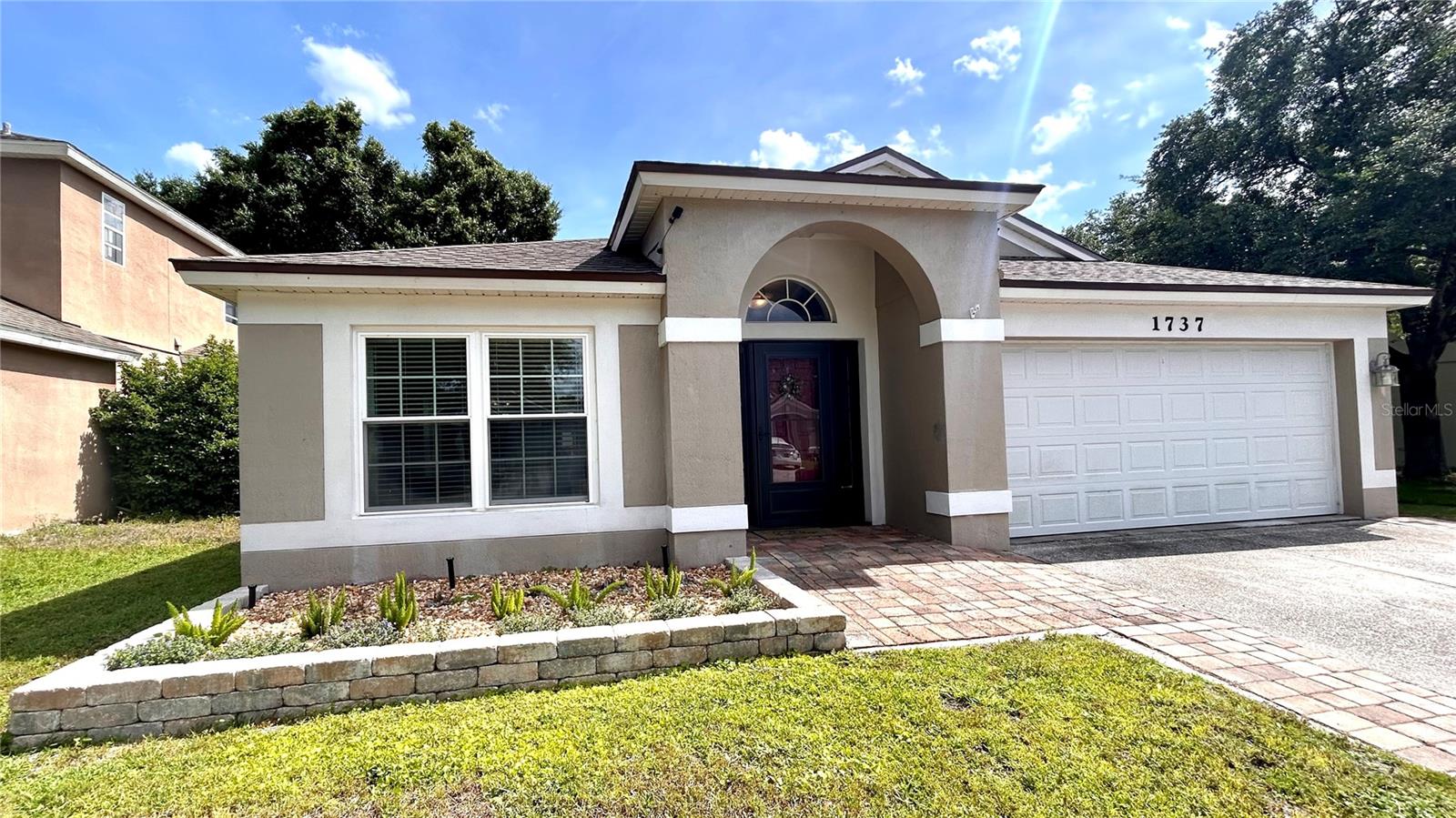What a gem!  Inside the gated community of Oakhurst Reserve, step into this inviting single-story home to discover a spacious open living-room and dining-room combo. The first hallway to the right leads to a large primary bedroom, with an attached  bathroom and a large walk-in closet! Past the well-appointed kitchen, with ample cabinet space and modern appliances, is a second hallway to the right. This hallway leads down to three more rooms (two carpeted bedrooms, and the third bonus room), as well as a second full bathroom. Toward the back of the house is an additional entertainment room, which shares an open concept with the kitchen. Beyond that is a third hallway, with an additional two bedrooms and a third full bathroom. This home has many updates, including new windows throughout, flooring and screened in lanai all done in 2024. As well as a water heater installed in 2022, a roof in 2021, and a Lennox 23 SEER HVAC system in 2020, ensuring worry-free living for years to come. The fenced backyard offers privacy and space for outdoor activities, making it ideal for entertaining guests or simply relaxing in the sunshine. Furthermore, the property includes an 8x12 storage shed, offering 100sq/ft of storage space to keep all your lawn equipment neatly organized, ensuring that your garage remains free for parking your cars. The Rainsoft EC5 water treatment system, valued at approximately $7500, will remain with the house. This system provides added value and convenience for the new homeowners, ensuring clean and fresh water throughout the home. The home is only a few houses down the street from the beautiful community pool and playground.