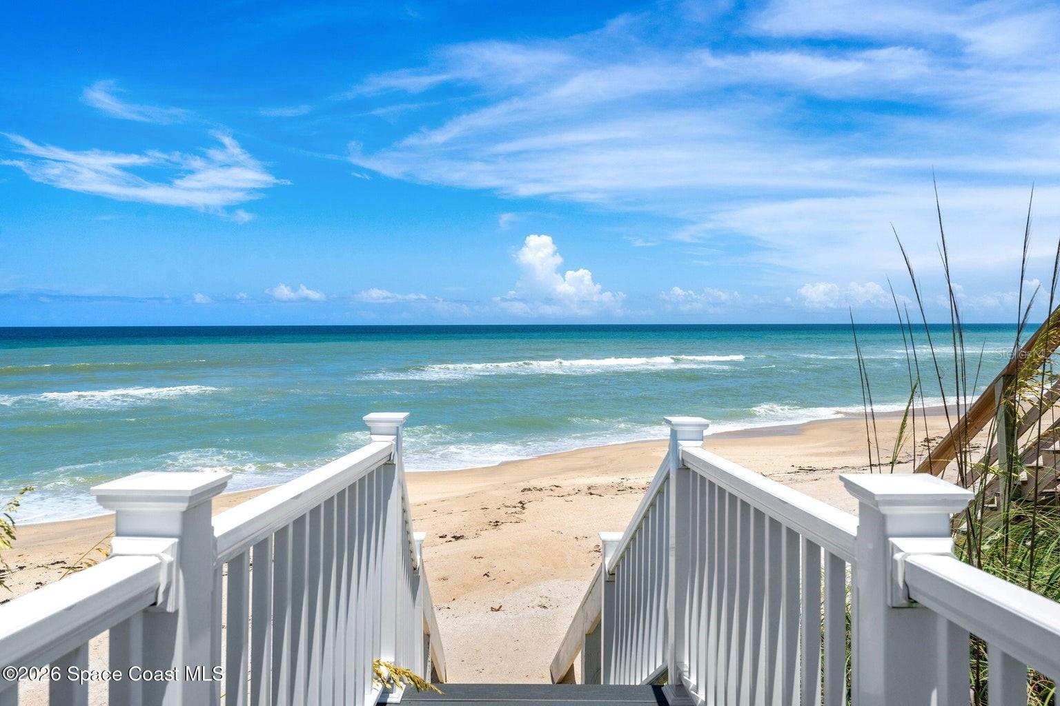 Oceanfront luxury meets modern peace of mind. Set along one of Melbourne Beach's most desirable stretches of coastline, this beautifully renovated retreat blends breathtaking Atlantic views with turnkey living. A private elevator services all levels, while a climate-controlled cedar wine room adds a distinctive touch. The stunning chef's kitchen is complemented by updated flooring, fresh paint, designer fixtures, renovated baths, and a reimagined laundry room. Ideal for multi-generational living, the first floor features a private bedroom, family room, kitchenette, full bath, ocean views, and direct pool access. Major updates include a new roof, impact windows and sliders, Trex decking, and 75-gallon water heater (all 2024), plus HVAC condenser units replaced in 2021, 2023, and 2023. Expansive indoor and outdoor living spaces capture endless sunrises, ocean breezes, and the coastal lifestyle Melbourne Beach is known for. Move in, unpack, and start making memories.