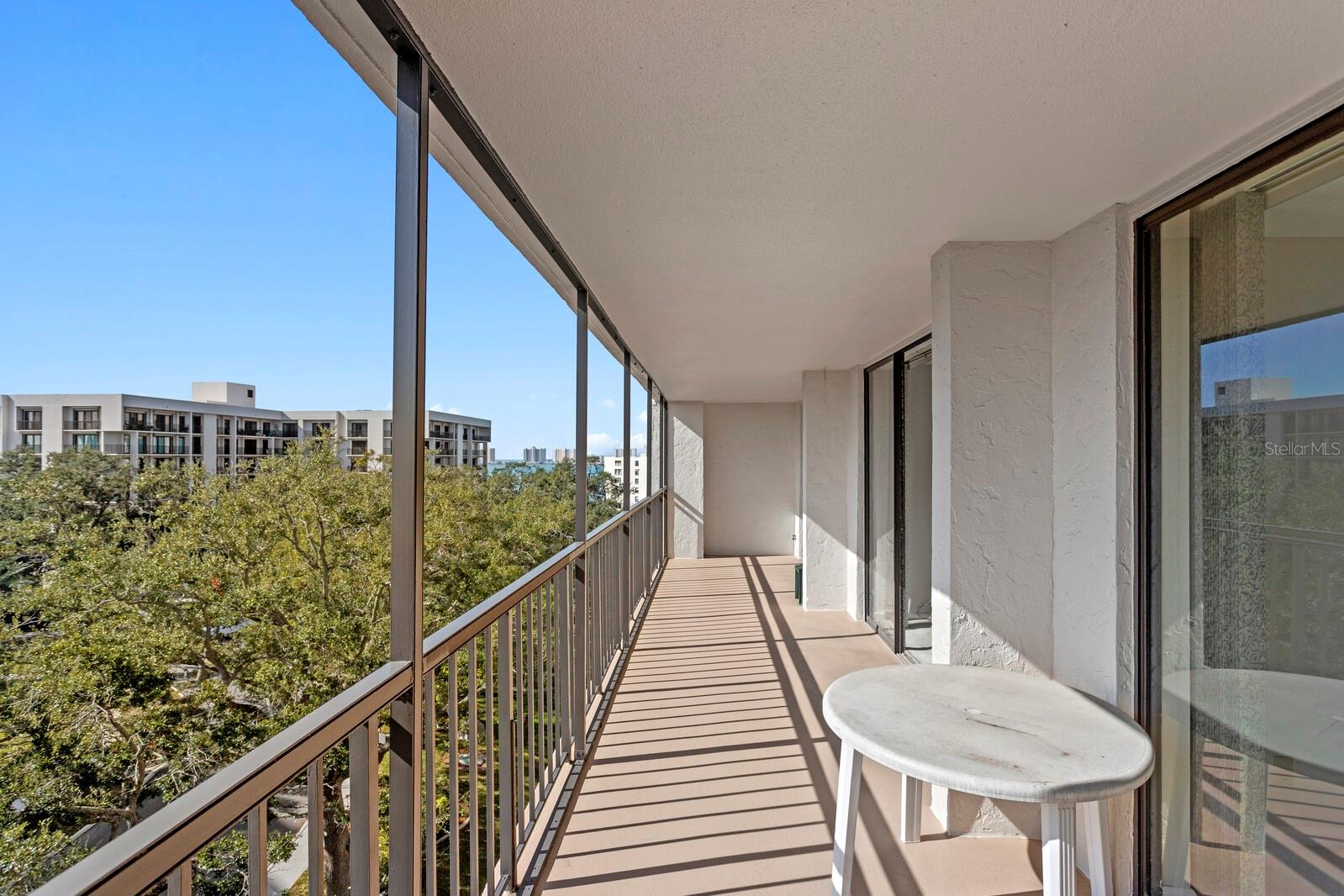 MINUTES TO THE OCEAN IN THE BEAUTIFUL GATED BELLEAIR COUNTRY CLUB COMMUNITY. This 2 bedroom, 2 bath has 1,310sf with an open floor plan and 1 car carport. Extra clean and ready for your personal touches, this condo has an unbelievable 39’ balcony with a partial view of the Intracoastal and GULF. The spacious living room opens to the balcony where you can enjoy the balmy Florida weather. The master suite is large enough for a king bed and has a private en-suite bath and double closets. The guest bedroom offers plenty of light through the slider to the patio and opens into the living room creating an open airy feeling. The Belleview Biltmore Villas offers idyllic scenery around the community and a HEATED AND CHILLED swimming pool with BBQ and waterfront seating. Tucked away in the back of the community and yet still close to the Belleair Country Club makes it an ideal location. Residents may skip the waiting list and be approved for access to membership at the Belleair Country Club, with activities abound! This private 24-hour manned gated community features Florida's oldest golf course and has two championship Donald Ross designed golf courses, fine dining, tennis courts, an exceptional gym, pickleball courts (all with separate membership). Plenty of highly rated restaurants, shopping & world class medical nearby. Award winning Clearwater Beach is only minutes away over the causeway. The $86 Million Coachman Park offers many FREE amenities and the open-air concert venue, The Sound Amphitheater offers big name artists. You’re only 30 minutes to Tampa International Airport, 20 minutes to the mall, and 5 minutes to Publix. Doesn’t get much better than this! Call today!