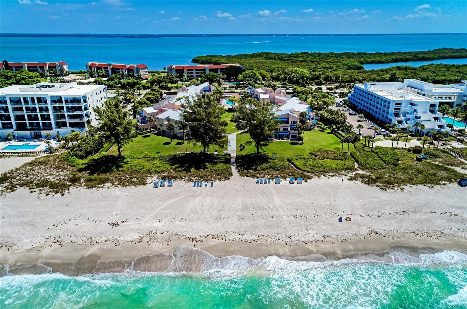 Welcome to Sand Cay Beach Resort—one of Longboat Key’s premier vacation destinations. VACATION WHEN YOU WANT - GENERATE INCOME WHEN YOU DON'T - TURNKEY GULF-SIDE INVESTMENT WITH REAL RETURNS. Rarely available third-floor condo truly impresses with soaring vaulted ceilings exclusive to top-floor residences, a beautifully updated kitchen, and tasteful coastal-inspired finishes throughout. A well-established vacation rental with a strong income history, this property is an ideal opportunity for both personal enjoyment and investment. Nestled within an intimate beachfront community offering 340 feet of pristine Gulf frontage, Sand Cay provides an exceptional resort-style experience. Residents and guests enjoy first-class amenities including tennis courts, shuffleboard, a heated pool, basketball area, barbecue stations, a full-time on-site manager, and a convenient in-house rental program. Perfectly located, the resort is just minutes from the boutique shops and fine dining of St. Armands Circle and the vibrant arts and cultural attractions of downtown Sarasota. Light and bright, this third-floor garden-view condo is ideally situated between the pool and the beach. The inviting floor plan features two bedrooms, two bathrooms, a spacious living and dining area, an updated and fully equipped kitchen, a cozy den/office nook, and a private balcony with an awning—ideal for morning coffee or unwinding after a day by the Gulf. Your slice of Longboat Key paradise awaits. Schedule your showing today.