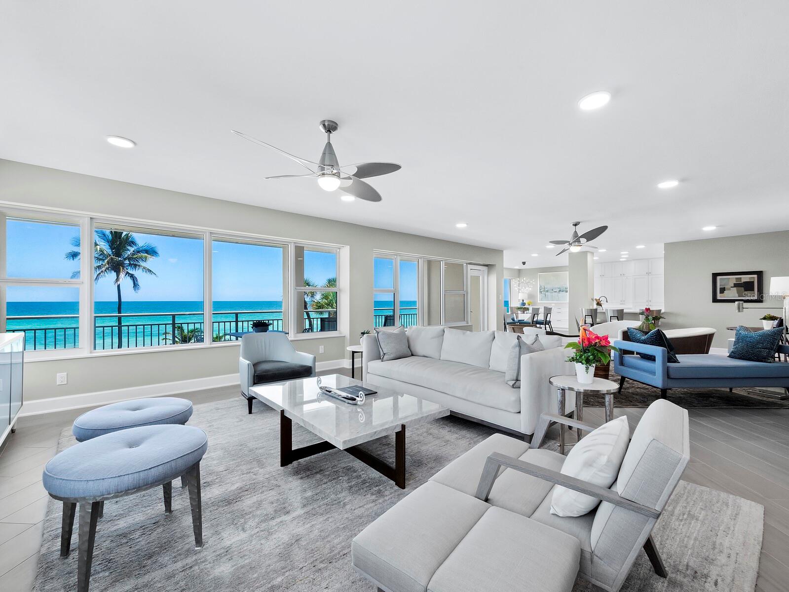 Discover luxury and elegance in this 3BR/3BA, 2,420+/- sq ft condominium at Longboat Key Towers. This residence offers exquisite beachfront living with tile floors leading to glass walls that showcase the stunning Gulf of Mexico views. 
The stylish kitchen features a beautiful tile backsplash, stone countertops, and a breakfast bar, all designed to highlight the breathtaking vistas. The spacious living room, perfect for entertaining, includes a wet bar and large glass walls that bring natural light and serene tropical views inside. 
The primary suite is a luxurious retreat with a wall of glass, terrace access, a custom walk-in closet, and a primary bathroom with dual vanities and a glass walk-in shower. Guest rooms provide ample space and comfort for family or visitors.
Enjoy the oversized balcony, a perfect spot to savor the sound of waves and stunning sunsets. Additional features include two covered parking spaces, a rare asset on Longboat Key. 
Longboat Key Towers, situated between the Gulf of Mexico and The Links Golf Course, offers a full range of amenities, including a fitness center with sauna and steam room, a heated pool and spa, a social room, and a guest suite available for owners to reserve. This residence spans the building, allowing for both sunrise and sunset views. Residents can also enjoy the benefits of a Longboat Key Club membership.