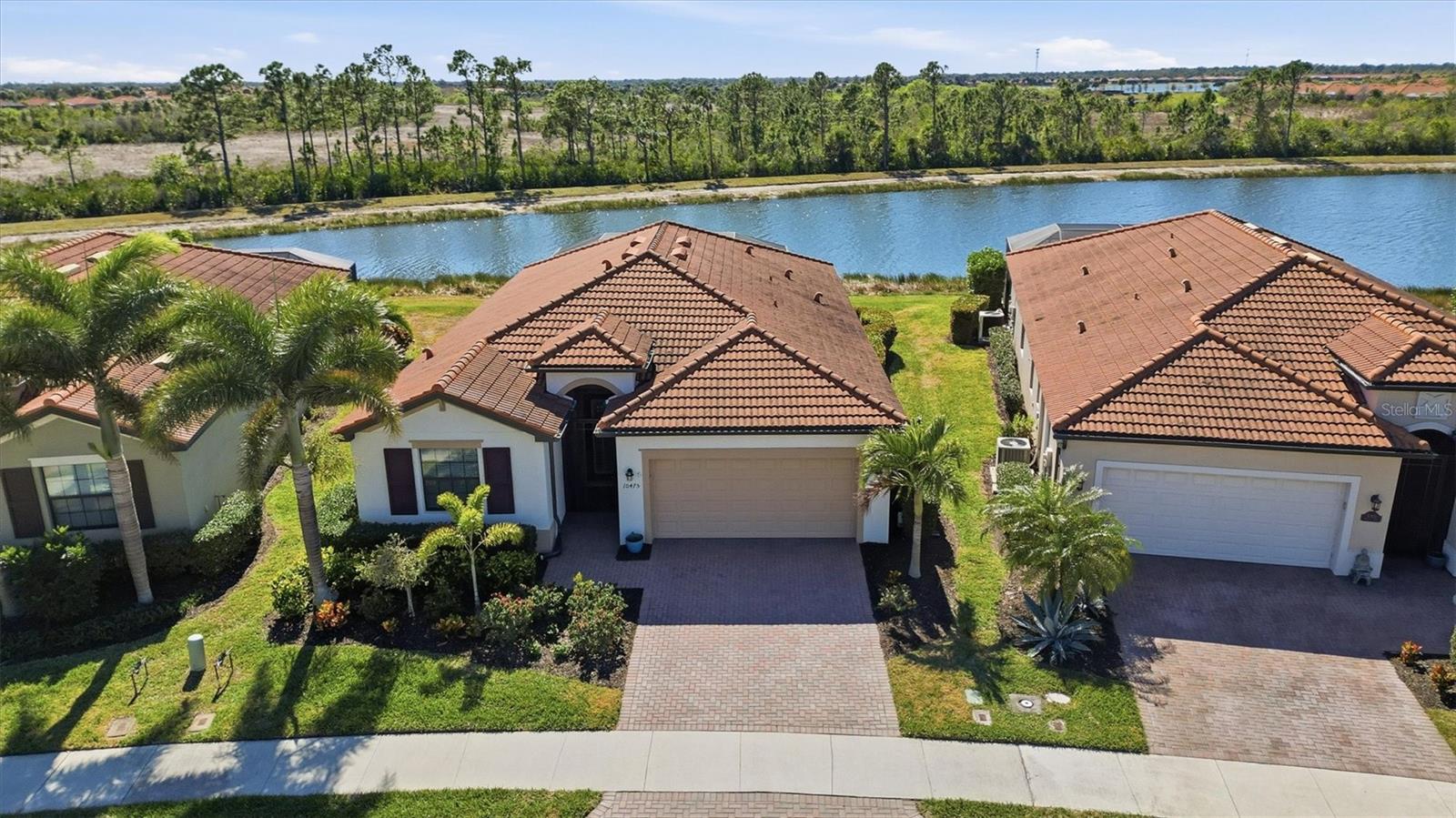 Welcome to your dream retreat at 10475 Medjool Drive in the estimable  Sarasota National Golf and Country Club! This stunning 4-bedroom, 3-bathroom home boasts tile flooring throughout, offering a seamless blend of elegance and functionality. Step into a bright, sun-filled space with southern exposure that floods the interior with natural light.
  The heart of the home features solid wood cabinets topped with granite countertops, complemented by convenient pullout shelves in the lower kitchen cabinets. Crown molding, chair rails, and decorative millwork add stylish touches throughout, while the primary bedroom showcases a striking feature wall for added style.
 Outside, enjoy ultimate relaxation in your private oasis: a heated saltwater pool overlooking a beautiful water view with a preserve beyond, ensuring total privacy. The rear lanai is equipped with a remote-controlled hurricane storm shade, accordion hurricane shutters, and a freshly re-screened lanai cage in 2024 for peace of mind during stormy seasons.
  Sarasota National is an Audubon Sanctuary-certified community, spanning over 1,300 acres of preserved lakes and conservation land, delivering breathtaking views and abundant wildlife right at your doorstep. Indulge in resort-style living with amenities including a fabulous pool, tennis courts, pickleball, bocce courts, a library and coffee lounge, and a 7,000 sq ft fitness facility—all part of a 30,000 sq ft clubhouse featuring a dining room, restaurant, and poolside tiki bar.
   This is more than a home—it’s a lifestyle. Don’t miss your chance to own this slice of paradise!