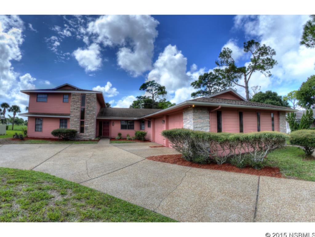 MOTIVATED SELLER SAYS BRING OFFER!  Executive home awaits the golfing family who loves to entertain!  You will love to entertain in awesome great room that features authentic, rare pecky cypress, stone fireplace and indoor gas grill next to it ... BBQ in A/C comfort! Super Bowl party will be a hit, as you serve your guests from sunken bar featuring refrigerated keg, ice maker and all the trappings, including copper top bar with leather arm rest. Two master suites, large eat-in kitchen and spacious laundry room.  Large master bath has separate tub and shower areas, each with its own commode.  Oversized garage, with twin 10 foot wide doors, nice depth and workshop area. Circular drive on 100 ft lot that fronts on municipal golf course, and your views go all the way to Wayne Avenue and not one neighbor behind you! Room for swimming pool, or join the heated, Fairgreen community pool by optional membership. Municipal Golf Course at your back door, or walk across the street and play a second round at Hidden Lakes Golf Course. Exterior freshly painted Aug 2015. Large eat-in kitchen has hard surface counters, some newer appliances, kitchen island and breakfast area larger than most dining rooms. Electric drapes on south walls, sun tunnels, double pane windows, and many other features make this a special family home. Great, central location, close to everything, short drive to beach. Located in popular Fairgreen Golf Community, but no H.O.A dues or restrictions, allowing you to fence your yard, and not need approvals normally seen with a Homeowner Association.  Lots to like in this spacious home that is ready for the golfer and family who enjoy entertaining. Offered As Is, inspections welcomed.   Measurements are approximate. ;Water: City