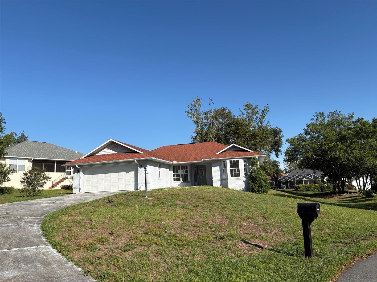 This Oakwood Village jewel sits on one of the largest lots in the community, located at the very end of a freshly paved cul-de-sac, and backs up to a common park area adding serenity and privacy. Cute & cozy, this home boasts a casual open living area, a bonus office/sunroom, underground electricity services, and a screened-in patio that spans the entire length of the house. This home is move-in ready with fresh paint, no carpet or wallpaper, and would make a great rental property. The recent structural updates include a ROOF (2016), A/C (2018), WATER HEATER (2019), SHOWER TILE in the guest bath (2020), GARAGE DOOR w/coded entry (2020), and SOD (2021). Your personal cosmetic touches would have so much equitable potential!