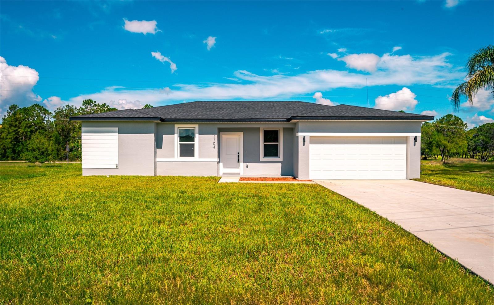 COMING SOON in Poinciana Villages! Welcome to 1103 Saint Tropez Court in Poinciana, FL — a brand-new, never-lived-in home tucked away on a quiet cul-de-sac and designed with modern comfort and style in mind. From the moment you arrive, the clean contemporary exterior, spacious driveway, and fresh landscaping create a warm and inviting first impression.Inside, you’ll find a bright open-concept layout with soaring ceilings, abundant natural light, and beautiful luxury flooring throughout. The kitchen is truly the centerpiece of the home, featuring white shaker-style cabinetry, quartz countertops, stainless steel appliances, matte black fixtures, and a large center island perfect for everyday living or entertaining guests. The spacious living and dining areas flow seamlessly together, creating an airy and welcoming atmosphere.The primary suite offers a relaxing retreat with dual vanities, elegant finishes, and a beautifully designed walk-in shower. Additional bedrooms provide flexibility for guests, hobbies, or workspace needs.Step outside to a generously sized backyard with plenty of room to create your ideal outdoor living space. Because the home is brand new, buyers can enjoy the peace of mind and efficiency that come with modern construction and untouched finishes throughout.Conveniently located near shopping, dining, parks, schools, medical facilities, and major roadways, this home offers easy access to everything Poinciana and Central Florida have to offer.This move-in-ready home is expected to generate strong interest once showings begin. Don’t miss the opportunity to be among the first to experience everything this beautiful new construction home has to offer!
