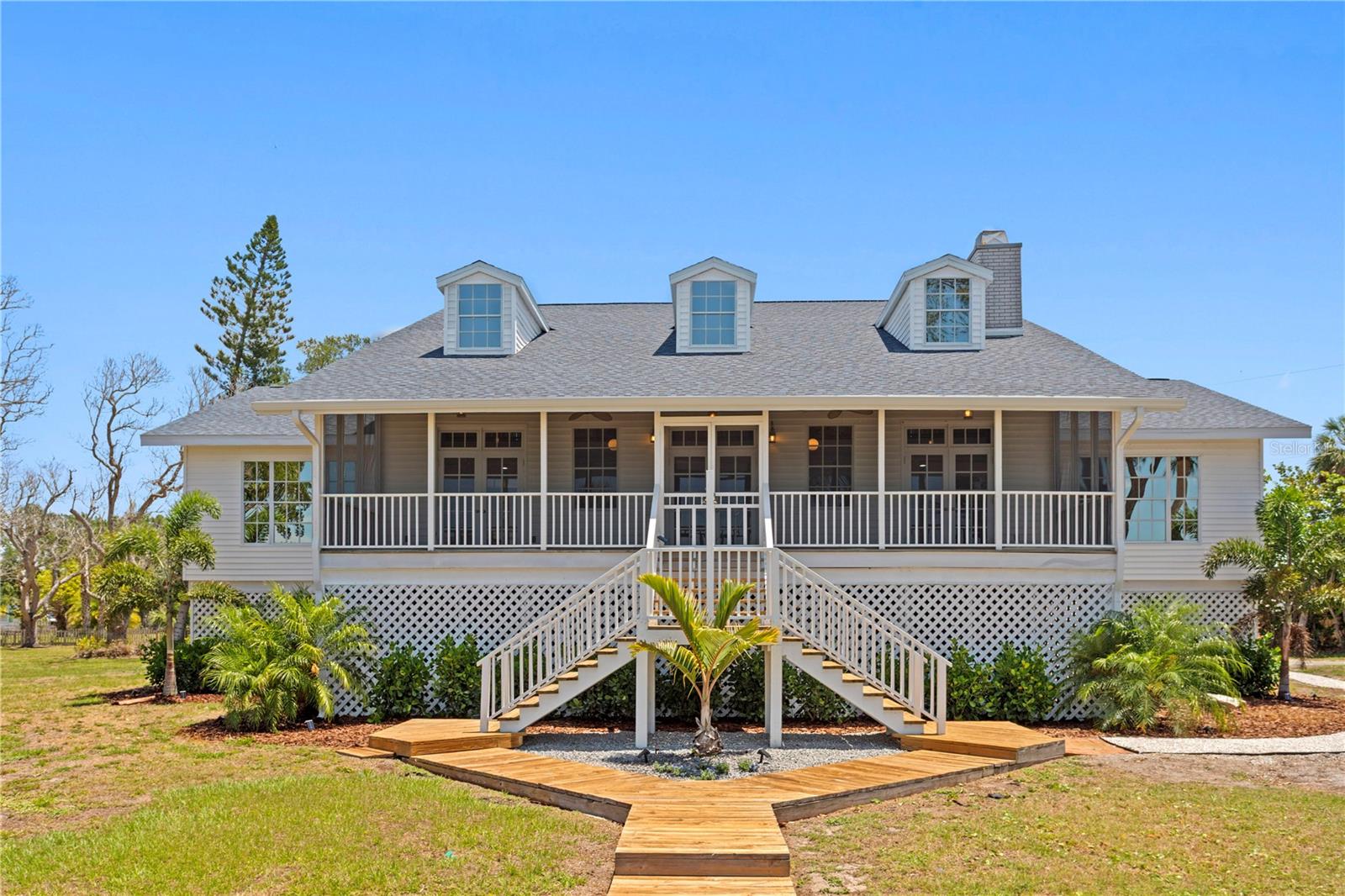 One or more photo(s) has been virtually staged. Welcome to a reimagined waterfront estate on the exclusive shores of Snead Island, where elevated design meets an effortless Gulf-front lifestyle. Extensive high-end renovations make this residence a thoughtfully transformed, refined coastal-chic retreat.
Offering 4 bedrooms, 3.5 bathrooms, and a private office/executive suite, this residence is thoughtfully designed to blend refined interiors with an extraordinary waterfront lifestyle. Stunning natural hardwood floors flow throughout the home, while the beautifully renovated kitchen serves as the heart of the residence, perfectly positioned to overlook the beach and breathtaking Gulf views, creating an inspiring backdrop for everyday living and entertaining.

The open-concept floor plan allows for effortless gatherings, seamlessly connecting the main living spaces and inviting the outdoors in through picturesque water vistas. The dining room is ideally situated to capture memorable meals, meaningful conversations, and sunset-filled evenings with family and guests. A private elevator further enhances the home’s comfort and convenience, providing effortless access between levels.

The private office or executive suite offers a rare and tranquil work environment, with calming beach views that transform the workday into something exceptional. The primary suite is a peaceful retreat, complete with a beautifully renovated spa-style bathroom, private exterior access, and its own charming porch, an intimate setting to enjoy morning coffee or unwind in the evening breeze. Every space within the home has been curated with a clean, sophisticated aesthetic that balances comfort, elegance, and the unmatched beauty of its coastal surroundings.

Beyond the interiors, the property unfolds into an oversized, newly landscaped homesite, leading to your own private beachfront escape where you will experience unobstructed sunset views. A brand-new roof further enhances the home’s turnkey appeal.

Perfectly positioned within the coveted Snead Island community, this residence offers an exceptional balance of privacy and accessibility. Conveniently connected to St. Petersburg, Tampa, and Sarasota, surrounded by the tranquil waters of Terra Ceia Bay, Tampa Bay, and the Manatee River, and near the 365-acre Emerson Point Preserve, residents enjoy effortless access to boating, nature trails, kayaking, and some of the region’s most pristine coastal landscapes. 

An exclusive offering of privacy, design, and waterfront living. Truly a must see!