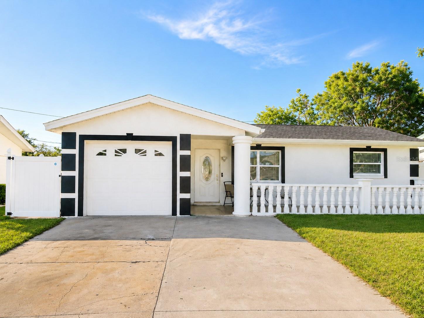 Virtually Staged. Welcome to this beautifully updated 3 bedroom, 2 bath home located in the heart of Pinellas Park! Featuring a desirable open floor plan and stylish wood tile flooring throughout, this home offers the perfect blend of comfort and functionality. The bright, modern kitchen boasts white cabinetry, stainless steel appliances, and ample storage, seamlessly flowing into the spacious living and dining areas.

Step outside to enjoy the inviting covered front porch or entertain family and friends in the fully fenced backyard complete with a generous patio area. Whether you’re hosting gatherings, enjoying your morning coffee, or creating your own outdoor retreat, this property offers plenty of space to enjoy the Florida lifestyle.

Conveniently located near shopping, dining, parks, schools, and major roadways, you’ll have easy access to downtown St. Petersburg, St. Pete Clearwater International Airport, and the area’s award winning Gulf beaches.

Additional upgrades include hurricane impact windows, a roof replaced in 2021, and a water heater replaced in 2024. Best of all, NO HOA 

Don’t miss your opportunity to own this move in ready home in one of Pinellas County’s most convenient locations. Schedule your private showing today!