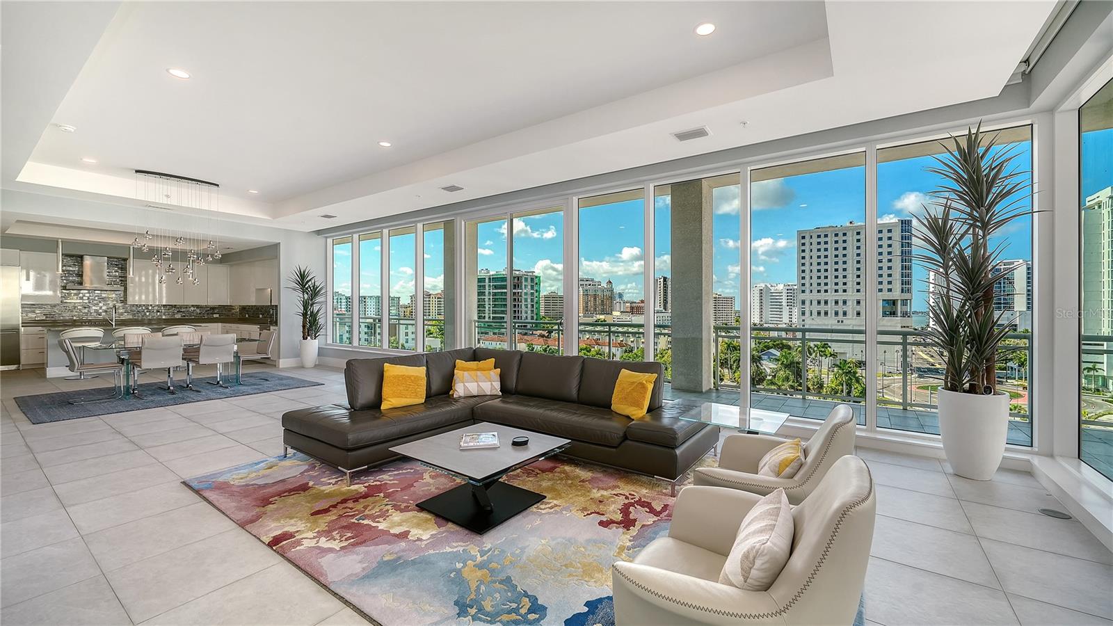 Welcome to BLVD Sarasota. This exceptional 8th-floor residence offers nearly 3,700 square feet of open living space with three bedrooms and four-and-a-half baths, while a private elevator opens directly into the residence. Floor-to-ceiling glass, expansive sliding doors, and 11-foot ceilings fill the home with natural light and create an open, inviting atmosphere throughout.

The spacious living and dining areas flow seamlessly to a large wraparound terrace overlooking the downtown skyline. The kitchen is equipped with professional-grade appliances, custom cabinetry, and a large island with seating. Porcelain flooring, modern finishes, and thoughtful design details give the residence a clean, contemporary style.

The primary suite features terrace access, dual owner-suite baths, a soaking tub, walk-in shower, and generous closet space. Each guest bedroom includes an ensuite bath and access to outdoor living areas.

Residents at BLVD Sarasota enjoy two levels of luxury amenities, including a rooftop pool deck with cabanas and fire pits, fitness center, golf simulator, wine storage, pet grooming station, two assigned parking spaces, and concierge services. Ideally located just moments from The Quay Sarasota, Ocean Prime, Sarasota Bayfront Park, shopping, dining, theaters, and Sarasota’s vibrant arts scene.

Call the listing agent for your private showing.