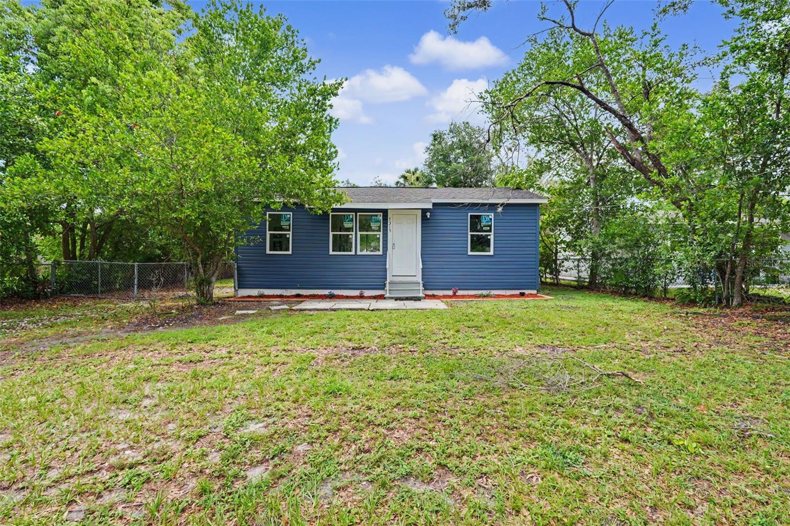 Welcome to this beautifully renovated 2-bedroom, 1-bathroom home in the highly desirable Seminole Heights neighborhood. Every detail has been thoughtfully updated, offering modern style, comfort, and peace of mind. Inside, you'll find stunning hardwood floors complemented by new porcelain tile throughout. The completely remodeled kitchen features elegant quartz countertops, stainless steel appliances, soft-close cabinetry, and plenty of workspace for cooking and entertaining. The fully updated bathroom boasts new plumbing, stylish tile flooring, and a classic subway tile shower for a fresh, contemporary look. Recent improvements include a brand-new 2026 roof, hurricane-impact windows, and new exterior siding, providing lasting quality and energy efficiency. A washer and dryer are also included for your convenience. The home comfortably accommodates up to four guests with two private bedrooms. Bedroom one with Queen-size bed and Bedroom two with Full-size bed. Step outside to enjoy the expansive, fully fenced backyard—perfect for pets, outdoor gatherings, or simply relaxing in the Florida sunshine. Unwind on the spacious back deck with your morning coffee, sip cocktails in the evening, or fire up the grill for a backyard barbecue while your furry friends roam freely. Located in the vibrant Seminole Heights community, you'll be surrounded by some of Tampa's best local restaurants, breweries, coffee shops, parks, and entertainment. Whether you're looking for a primary residence, a long-term rental, or a charming retreat, this beautifully updated home offers the perfect blend of modern amenities and neighborhood character. Don't miss your opportunity to experience the charm, convenience, and welcoming atmosphere that make Seminole Heights one of Tampa's most sought-after communities.