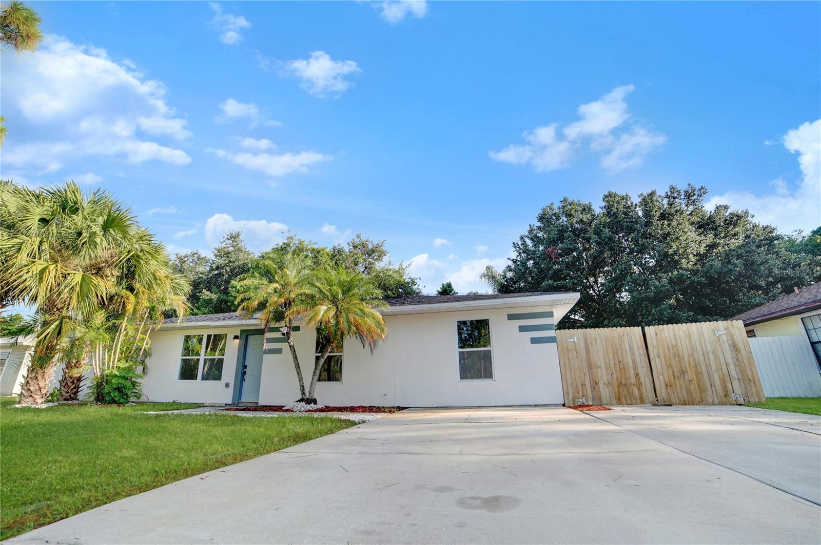 Introducing 4540 Greenhill St, Cocoa, FL 32927! This stunning canal front home has undergone a complete renovation, offering a fresh and modern living experience. Boasting three bedrooms, two bathrooms, and sprawling over nearly a quarter acre, this property is ideally located just minutes away from the Indian River, making it a dream for boating enthusiasts. With approximately 1,500 sq ft of living space, this home provides ample room for comfortable living. Step inside and be greeted by high ceilings that create an open and airy atmosphere, complemented by an abundance of natural sunlight streaming through the brand-new windows and tile flooring throughout. The expansive living room features French doors that lead to a screened-in porch allowing for relaxation and entertainment, seamlessly blending indoor and outdoor living. Adjacent to the living room is the newly remodeled kitchen, which leaves nothing to be desired. Boasting a complete overhaul, the kitchen presents a fresh and contemporary aesthetic, complete with stunning countertops, custom Shaker-style cabinetry, and stainless steel appliances. The space is further enhanced by recessed lighting and designer fixtures, accentuated by a captivating herringbone pattern tiled wall. Conveniently located beyond the kitchen is the laundry room, offering direct outdoor access. This versatile area provides ample space for an office or workspace, catering to the needs of modern living. The primary bedroom is a true retreat, featuring an impressive ensuite bathroom and a walk-in closet adorned by custom barn doors. Two additional guest bedrooms and a guest bathroom provide comfortable accommodations for family members or visiting guests. Stepping outside, beyond the screened-in porch, you'll discover a spacious patio and an expansive backyard eagerly awaiting your personal touch. This outdoor space offers limitless potential for creating your own paradise, and the canal frontage adds an extra element of charm and allure. This home has been renovated from top to bottom, ensuring peace of mind for years to come, including a NEW ROOF and NEW tankless water heater. Don't miss the opportunity to own this completely renovated gem, offering a harmonious blend of modern aesthetics, functional living spaces, and a prime location near the Indian River. This home would make for a great house hack as the primary bedroom has a private entry door! Perfect spot for an Airbnb! Schedule your private showing today and envision the possibilities that awaits in this truly move in ready home.