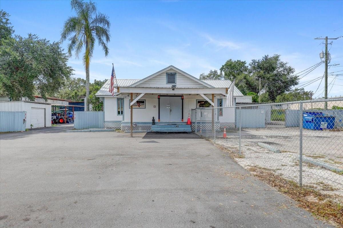 Prime Commercial Property – Consisting of 2 adjoined parcels totaling 3.3 Acres MOL with two office buildings on the High-Traffic Highway of U.S 92. The 2nd parcel is 11309 E. U.S. Highway 92. Entire Repossession business is also available for sale under MLS TB8452371. Unlock exceptional business potential with this rare opportunity to own over 3 acres of commercially zoned land. Located directly on a high-visibility, high-traffic highway with approximately 334' of road frontage on a very busy U.S. Highway 92 with average daily traffic over 15,000 cars! This strategic location offers outstanding exposure and accessibility being less than 1 mile from I-75 and having easy turn lane access. This property is ideal for a variety of commercial uses and currently operates as a repossession and towing company. The property features two newly renovated office buildings, with the main office featuring a reception area, lobby area, several offices, large storage areas, and kitchen area. The rear of the main office building has been renovated from previously open garages to now enclosed storage rooms with insulation and A/C. The additional office trailer is also renovated and has a main area and several additional office rooms. There are also several openworkshops on site with high ceilings some of which are currently used for a car wash. There are two additional steel storage buildings with garage doors. An RV parking pad with a 50 amp hookup and septic is on site, along with 2 wells, and 2 separate electric meters. The land has been completely cleared and asphalt/pavement has recently been poured for an abundance of parking available. The property is fully fenced with a new metal fence in the rear and back sides and a new chain link fence in the front and front sides. There are 3 security entry gates including an electric main entrance gate with remote opener. The land is high and dry in Flood zone X! A/C is less than 1 year old and the roof is approximately 4 years old. The zoning is General Commercial which provides flexibility and is suitable for professional offices, car lot, retail, distribution center, gas stations, manufacturing, mixed-use operations, and a whole lot more! Ample parking, established infrastructure, and multiple access points make this site move-in ready. With strong demographics and steady growth in the surrounding area, this property offers both immediate utility and long-term upside. Whether you're expanding your business, looking for a turnkey investment, or seeking a redevelopment opportunity, this location delivers. Don’t miss your chance to own a premium commercial asset in a proven corridor! SELLER FINANCING AVAILABLE
