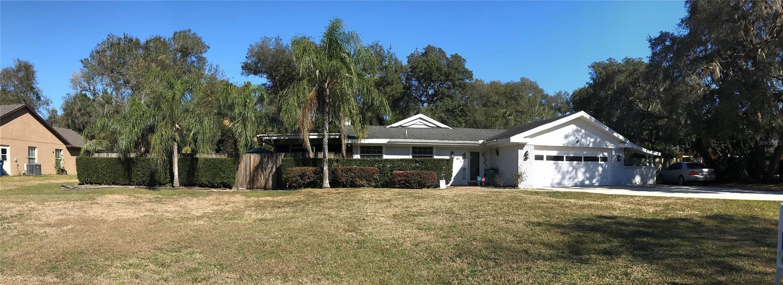 Hidden gem!   This house will wow you with the over sized lot for all your toys, garden, and more.  Relax in your pool and enjoy family time in the large screened in Florida room!   Walk in closets, and storage for days!  Your cats will love all the cut outs in the fence for their exploring needs, and dogs have doggie doors for easy access to the yard.   Photos just will not do this justice.