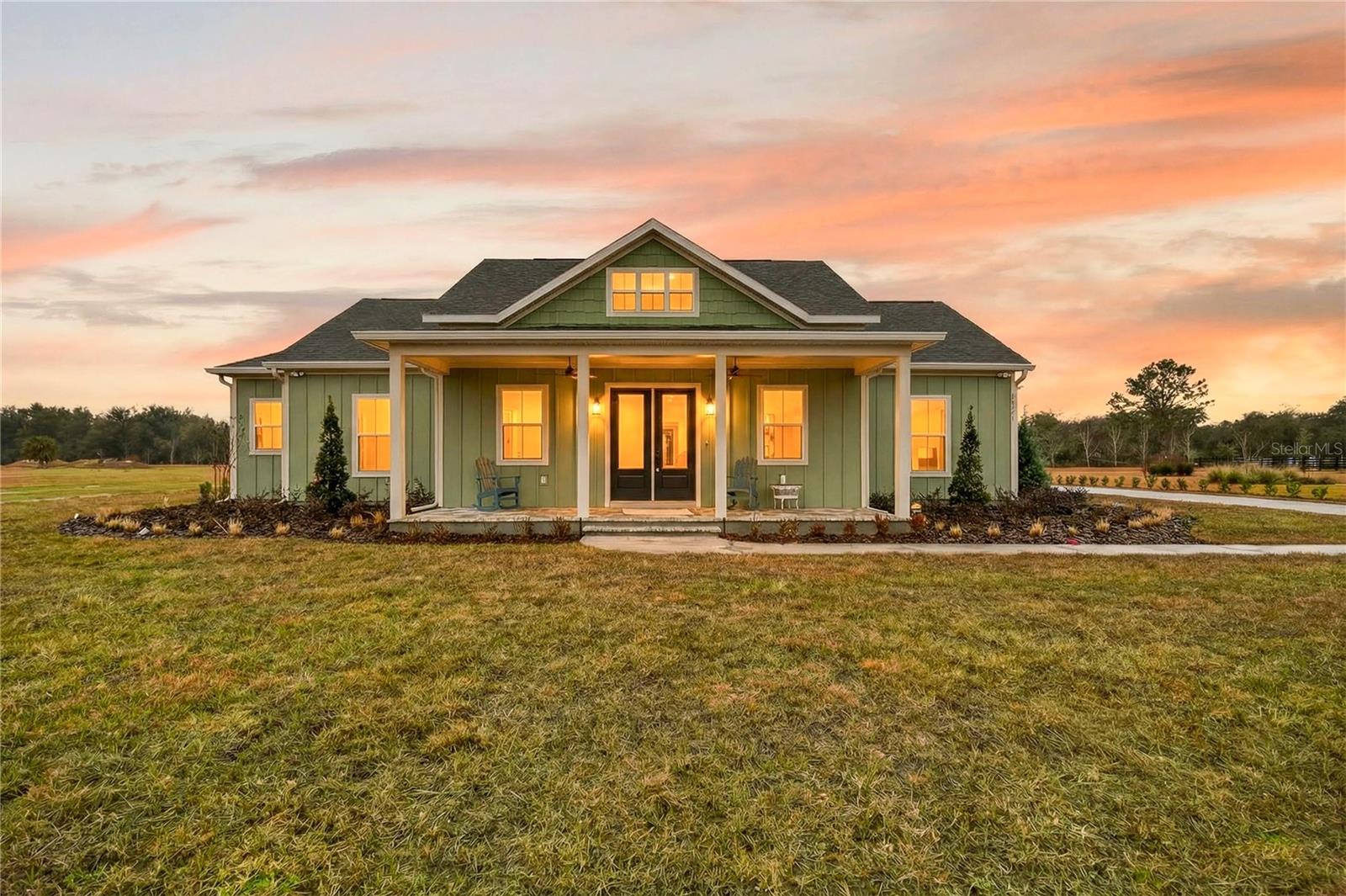 Welcome to Shoreline Ranch Community. Please use the gate code listed on the sign out front of the community for access.

This beautiful 4 bedroom, 2 bathroom home with stunning landscaping on a 1 acre lot is located in Lake County, FL. Features include floating cabinets with LED lighting in both bathrooms, a heated pool with screen enclosure, abundant storage space, undermount sinks, an EV charger installed in the garage, a stunning vapor fireplace with TV, community boat ramp and dock access, professionally landscaped lawn, kitchen backsplash, pavers on the front and rear porch, and a pantry with cabinets.

Contact us today to schedule a showing.

**This is a Builder Model. Please note that occupancy will not be available until December 2026.