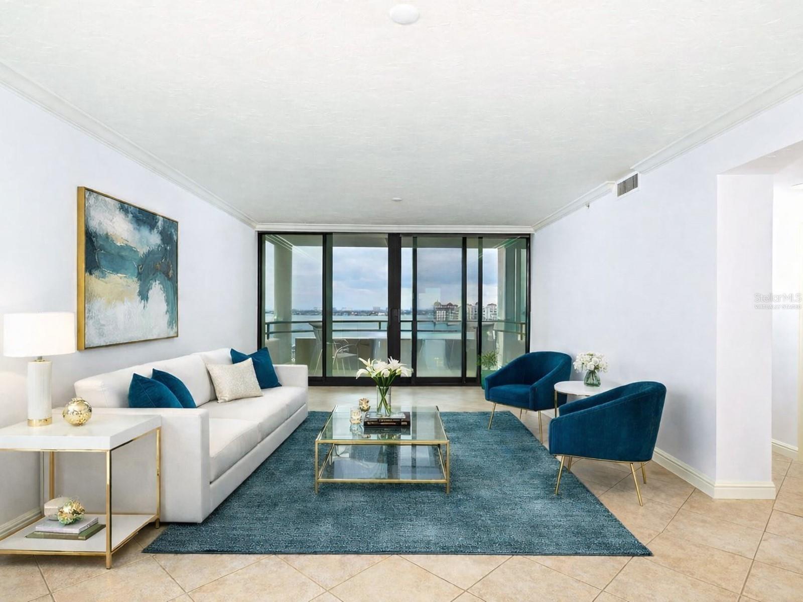 One or more photo(s) has been virtually staged. Experience the pinnacle of downtown Sarasota living at Bay Plaza, where the 11th floor showcases breathtaking, sweeping vistas of Sarasota Bay and the Gulf of Mexico—views that truly impress from every angle. An updated great room with a spacious, inviting layout, perfect for both relaxation and entertainment. It offers ample space for both the living and dining areas, making it ideal for gatherings. Additionally, there are two beautifully designed en-suite bedrooms and bathrooms. Throughout the home, you'll find crown moldings, recessed lighting, custom built-ins, solid-surface counters, modern, high-quality cabinetry, and tiled flooring set on the diagonal, all of which truly elevate the space! You'll absolutely love this elegantly remodeled kitchen! It’s generously sized, with dramatic granite countertops and a delightful peninsula with bar seating. The open shelving and glass shelves add a stylish touch, while the service entrance and convenient laundry closet make life easier. Imagine creating your dream coffee bar or a cozy home office nook in the flexible space. Plus, it comes equipped with a built-in pantry, sleek stainless-steel appliances, a tiled backsplash with glass tile accents, and task lighting. The Owner’s Suite is thoughtfully located for privacy and boasts amazing views. It has an accessible bathroom that is appealing to everyone, including individuals with disabilities. Key features include double sinks, lots of cabinetry, solid surfaces, a zero-entry tiled shower with dual showerheads, and a wide doorway with a pocket door leading to an expanded water closet designed for mobility with bonus storage. The double primary certainly has its standout characteristics on the other side of the floor plan, with convenient access to the secondary bath and views of the bay. This residence is not only move-in ready for your comfort and enjoyment, but it also shines with spotless perfection. Discover the joy of stepping into a home that feels custom-made for you, where you can truly relax and make it your own from day one! As a resident of Bay Plaza, you will benefit from exceptional amenities, including 24/7 valet parking, convenient EV charging stations, and unmatched concierge services available around the clock. The building has recently been transformed with the installation of impact-resistant glass, elevating its sophistication and ensuring both style and safety. Unwind in the luxurious heated swimming pool, soak in the rejuvenating spa, or maintain your fitness routine in the state-of-the-art fitness room, complete with a European sauna and steam room. Nestled in the heart of downtown Sarasota, this prestigious building is surrounded by a variety of trendy restaurants and boutiques. Residents can effortlessly immerse themselves in the vibrant cultural scene, with Whole Foods, the Theatre, and the Opera just moments away. Enjoy the spectacular 4th of July fireworks at Marina Jacks from the comfort of your balcony. With its unbeatable location just minutes from St. Armands Circle, Longboat Key, and Sarasota’s stunning beaches, this unit offers an unparalleled opportunity to embrace the dynamic social lifestyle that downtown Sarasota proudly provides. Don't miss your chance to make this exquisite residence your own!