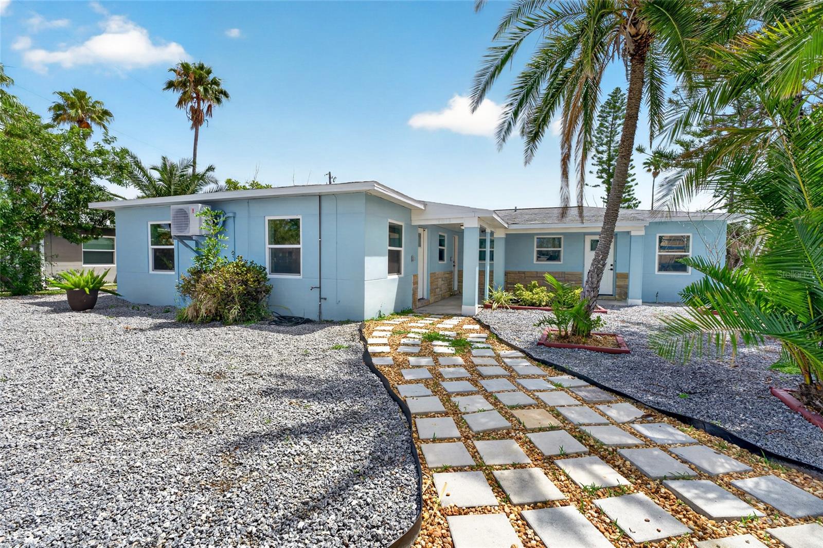 Virtually Staged. Price reduced to sell!  Completely renovated triplex in desirable Madeira Beach.   All work was done to code and permits are all completed and closed.  Three units suitable for many options including multi-generational occupancy and/or rental income or whatever the new owners desire! Updates include completely remodeled kitchens with new stainless-steel appliances and new cabinetry, new lighting and plumbing fixtures, updated electrical, two mini-split systems in each unit, and new double-pane hurricane-impact windows.  The largest unit is the middle unit which has some extra large windows and French doors in the spacious living room that exit to a patio space. All tile floors, zero carpet!   No HOA fees!  The shed contains a brand new washer and dryer with hookups already in place for future use.  All work has been permitted to current codes and all inspections completed.  The oversized backyard can be used for additional parking and/or outdoor enjoyment.  This property is just a three-minute drive or less then a ten-minute walk to the beautiful sparkling beach! John's Pass and Treasure Island and many other nearby beaches, other local restaurants, beach and water-based activities like dolphin cruises, jet skiing and fishing charters. So many bars and other tourists and desirable attractions are either walking distance or a short drive away.  Schedule a private tour of this property as soon as possible!   A beach town gem especially with income potential like this property doesn’t come around very often!