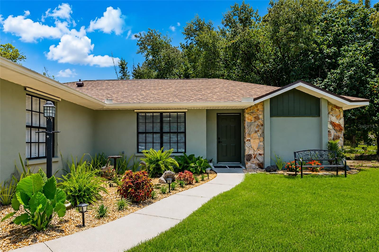 Feast your eyes on this delightful home that has been completely renovated . The owner has remodeled this home from top to bottom. Renovations  include ; new roof, newer HVAC ,all new ductwork, newer water heater ,new luxury vinyl flooring throughout ,all new kitchen with granite counters, all new remodeled bathrooms,,fresh paint on the exterior and the interior ,re-screened lanai ,new landscaping and new lush green grass.This home is nestled in the serene, agricultural-zoned community of Hidden Meadows, this charming single-family home offers peaceful country living with convenient access to modern amenities. NO DEED RESTRICTIONS . NO HOA FEES , NO CDD FEES . This residence sits on a spacious 1.02-acre corner lot with lakefront views, providing privacy and room to roam. As you enter the home you will see the spacious great room with soaring ceilings and a wood burning fireplace. Open-concept living and dining and kitchen area anchored by a cozy wood-burning fireplace with stone hearth and mantel. Primary suite with en-suite bathroom , vanity with double sinks ,custom walk in shower and walk-in closet on one side; two guest bedrooms and a second full bath on the other. The split bedroom floorpan allows both the owners and the guests privacy.

  Relax in the great room by the wood burning fireplace or sit on the screened lanai with an iced tea and enjoy the new "zen garden area." The mature trees on the property give you privacy and shade on a hot Summer's day . Unwind and enjoy the wildlife by the pond . This property is a gardeners delight with room for a future vegetable or flower garden .. The possibilities are endless .... 
Ample outdoor space for RVs, boats, Motorhome or toys.
Located west of I-75, you're just minutes from restaurants, and shopping at UTC mall. Benderson Rowing, Ringling Museum, Mote Aquarium, Pop Stroke golf course, and  Close to the beautiful beaches of Anna Maria Island!
This home blends comfortable Florida living with rural charm — a rare find for those seeking space, privacy, and low-maintenance updates. Perfect for families, hobbyists, or anyone wanting a slice of countryside close to the city Bring your home based business. Room to build an accessory Dwelling( ADU ) or add a SHE shed .