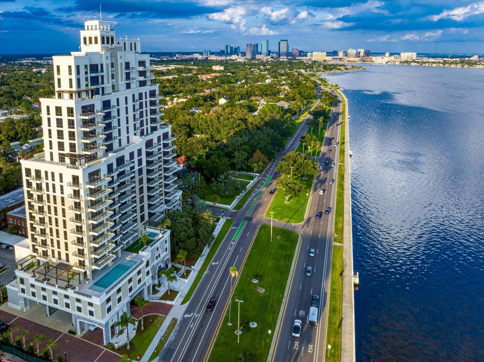 Rarely available, this expansive 3-bedroom plus den, 3-bath Glenwood residence at Hyde Park House offers 3,000 sq ft of luxurious living on the 17th floor, showcasing both sunrise and sunset views over Bayshore Boulevard. Developed by The Kolter Group—known for ONE St. Petersburg and The Ritz-Carlton Residences Sarasota—Hyde Park House is South Tampa’s premier new high-rise, located in the heart of Historic Hyde Park. This exclusive floor plan is one of only five in the building and features wide-format porcelain flooring, 8’ paneled entry and interior doors, Nolte European cabinetry with LED task lighting, quartz waterfall island, Gaggenau appliances with induction cooktop, and Electrolux washer and dryer. Residents enjoy private access to resort-style amenities on the 5th floor, including a heated pool, spa, firepit lounges, outdoor kitchen, social lounge, and state-of-the-art fitness center. Don’t miss this rare opportunity to own in one of Tampa Bay’s most coveted luxury buildings.