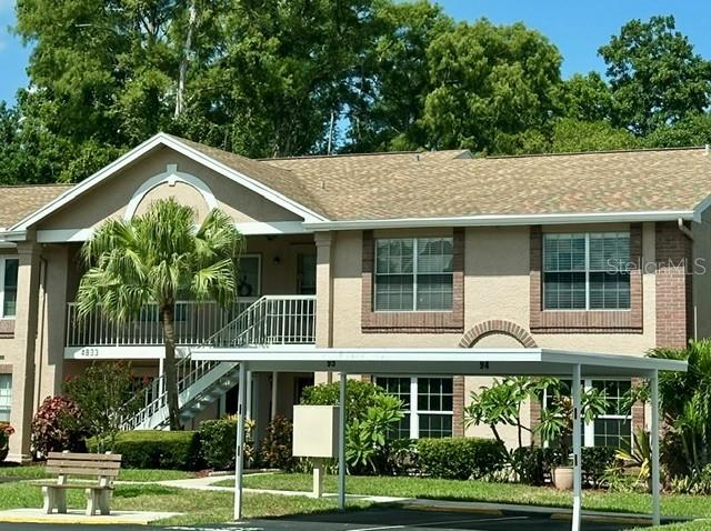 Welcome home to this STUNNING, FULLY FURNISHED, TURN-KEY, low-maintenance gulf coast condo located inside the peaceful, park-like Sunnybrook gated community. Situated on a quiet, private road with no through-traffic, this 935 sq. ft. residence features an ideal split-bedroom layout, open-concept kitchen/family room combination, and soaring cathedral ceilings that create a bright, airy environment.
The 2nd floor unit requiring no flood insurance, comes with waterproof vinyl flooring throughout.  New HVAC system and copper piping installed 6/2026 and fully warranted.  Full size top of the line GE Profile Washer/Dryer combo single unit on a raised platform with custom built-in shelving and additional underneath storage. Interior Features include a bright kitchen-family room combo with cathedral ceilings Classic mid-century modern living area with wall mounted TV Adjacent bar height pub-style dining table and uninterrupted sightlines.
Spacious Master bedroom with ample walk-in closet space and a private modern en-suite bathroom.  Comes with a his and hers sitting/reading area and natural water views, and gorgeous Farmhouse style appointments.  The Second bedroom/office space includes a large window for natural light, a desk, lateral file cabinet, closet storage, a third wall mount tv, and an electric fireplace for a warm calm vibe off the living area.  Updated open Kitchen with newer black whirlpool appliances, a microwave and air fryer, added cabinetry and coffee bar, and custom shelving for added capacity in the pantry.  A custom African Acacia wood finished passthrough bar allows easy service for entertaining and complete views of the Dining and living areas.  Private screened lanai with private outdoor storage and bistro set, perfect for enjoying morning coffee, with built-in remote-controlled lighting and a ceiling mounted fan.

Sunnybrook Gated Community Amenities
Resident parking provided plus ample adjacent guest spaces.
The Sunnybrook Condominium Association is a highly desired, active, and secure neighborhood that provides maintenance-free coastal resort living with a pristine heated swimming pool, hot tub, and sundeck, On-site tennis, pickleball, bocce, and shuffleboard courts. The large community hall features pool tables, card rooms, and scheduled social activities/bingo.
Convenience: 
Fully gated community entrance, on-site property management, and immaculate landscaping.
HOA Fee Covers: Cable TV, water, sewer, trash, exterior building maintenance, roof, and ground maintenance and scheduled re-paving.

Prime Location:
Less than 20 minutes from local Gulf coast beaches and scenic fishing piers, Sims park and the Cotee River, downtown New Port Richey main street shopping, restaurants, and golf courses, and the Tarpon Springs sponge docks, gulf-front and river front dining.
Located just 25 miles north of Tampa and 15 miles to Clearwater / St. Petersburg for easy metropolitan access, Professional sports, Fine Arts venues, museums, aquariums, and world class beaches.