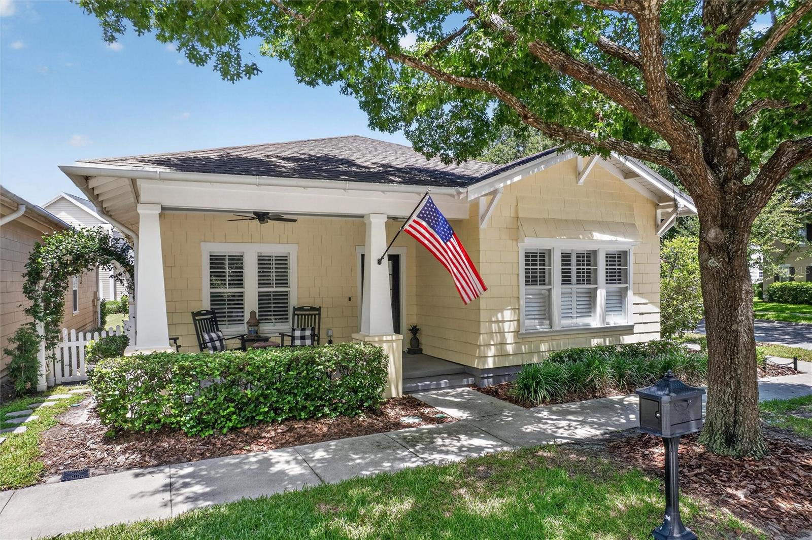 PERFECTION!! This Beautifully updated single-story home sits on an EXTRA LARGE CORNER LOT with a private fenced yard, facing parkland and conservation.  A large Primary Bedroom Suite is separated from 2 additional bedrooms by a formal dining room, eat-in kitchen and family/living room. The custom side door from the family room opens onto a Trex extended porch - entry to your outdoor oasis! The expansive outdoor living space of over 1000 Sq Ft includes an underlaid paver patio, privacy fencing, water feature and mature landscaping. When you're not enjoying the outdoor tranquility, the interior 2022 Comprehensive renovation blends timeless Craftsman-inspired details with modern upgrades - LVP flooring throughout, smooth walls and ceilings with recessed LED lighting, custom trim and millwork, plantation shutters, Hunter Douglas window treatments, solid Craftsman doors and hardware and an updated kitchen featuring quartz countertops, Premium Bosch stainless steel appliances, and additional custom cabinetry. Both bathrooms have been thoughtfully renovated, while major system updates include a 2022 HVAC Heat pump and hybrid heat pump water heater. The rear-entry two-car garage includes RaceDeck flooring, and a laundry corner with high-end 2022 Samsung Washer & Dryer. And for location? This lot is just one block from the heated Spring Park Pool and Playground, and under a mile from Downtown Celebration with all of its shops and restaurants! Don't miss your opportunity to enjoy Celebration Living at its FINEST! Check out the virtual tour link for a site with a 3D walk-through experience, floor plans and more photos.