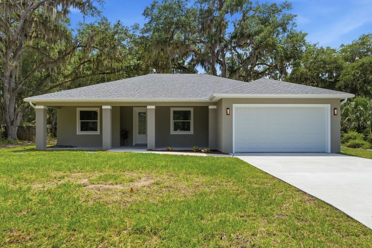 Welcome to your brand-new Florida retreat, perfectly positioned in one of DeLand's most desirable outdoor lifestyle locations! Situated on a spacious .31-acre lot directly across from Lake Beresford, this beautifully crafted 3-bedroom, 2-bathroom home offers 1,631 square feet under air and 2,369 total square feet of thoughtfully designed living space. From the moment you arrive, you'll notice the attention to detail that sets this home apart, including the charming tongue-and-groove ceiling on the front porch ceiling, 42'' cabinets and granite throughout creating the perfect spot to enjoy your morning coffee or unwind after a day on the water. Inside, you'll find a bright, open floor plan designed for modern living, with quality finishes and a layout that seamlessly blends comfort and functionality.

Location is everything, and this home delivers. Just minutes from Hontoon Island State Park, you'll enjoy easy access to hiking, kayaking, fishing, and some of Central Florida's most beautiful natural scenery. Boating enthusiasts will appreciate being close to multiple public and private boat ramps, a nearby marina, and the prestigious DeLand Yacht Club. Commuters and travelers alike will love the convenience of having both a SunRail station and an Amtrak station nearby, making travel throughout Florida easier than ever.

Whether you're seeking a full-time residence, a weekend getaway, or a place to embrace Florida's outdoor lifestyle, this stunning new construction home offers the perfect combination of location, craftsmanship, and convenience. Don't miss your opportunity to own a piece of paradise near Lake Beresford!