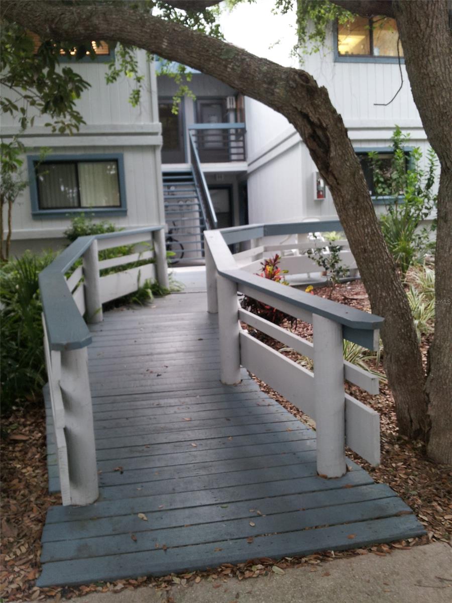 When you turn into the complex you are under an awning of trees.  This complex is beautifully kept with 3 pool, 3 tennis court, pickle ball court, shuffleboard, library, clubhouse, and lots of activities.  The beach is only steps away up the wooded pathway and across the street to the boardwalk and no-drive beach.  The unit is a first floor unit with 2 bedroom/2 full baths, lots of tile and wood laminate in the bedrooms.  The kitchen has newer appliances and is light and bright.  The split bedrooom plan adds to privacy and master bath has a beautiful walk in shower.  The laundry in in a closet so very convenient.  There is a small porch at the back of the home overlooking a wooded garden area.  Sit and have your coffee and watch nature.  Looking for peace, ocean or pool, and the vacation life 24/7, this is your next stop.  Check it out before it is too late. ;Water: City