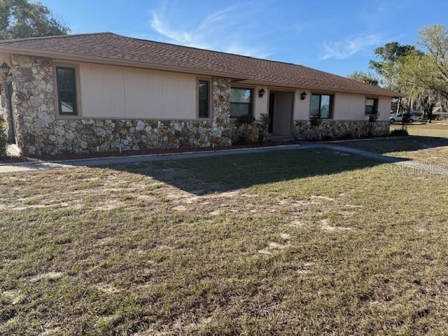 Spacious Pool Home on over 1/2 Acre Homesite. NO HOA!  Split 3 Bedroom 2 Bath Plan, Inside Laundry, NO CARPET.  New Roof in 2021, a/c in 2017, pool deck resurfaced in 2021 and New Windows in 2017/2021.  Range, Microwave, Disposal and Dishwasher replaced in 2021.  Offering an IN-GROUND POOL and HUGE SCREENED BIRDCAGE.  Oversized 2 Car Garage, Fenced Corner Lot, with double gate to store your RV or other vehicles.  Bring your Fishing Gear and BOAT, neighborhood has lake access, and is only MINUTES to the many boat launch areas on the FAMOUS HARRIS CHAIN of Multiple LAKES.