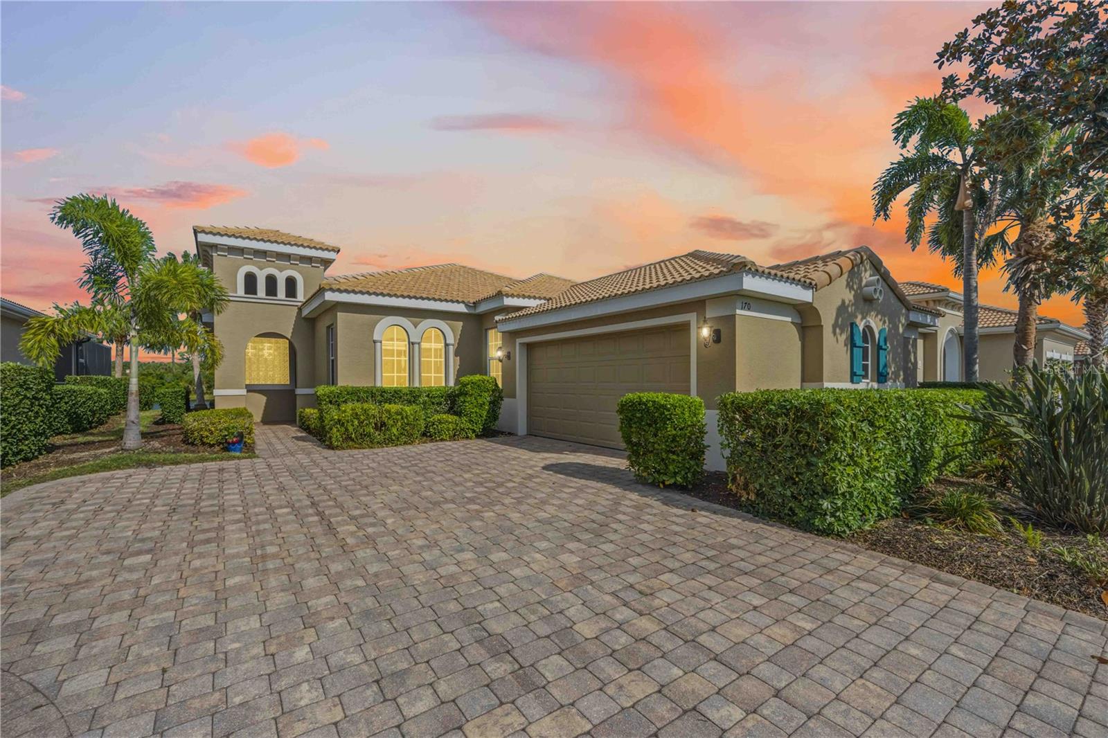 3 Bedroom 2 bath Stunning Water View Luxury and Sunrise views in Venetian Golf & River Club Resort Community.  Perfectly positioned to capture serene water views, this home offers an exceptional blend of elegance, comfort, and resort-style amenities.
Step inside this WCI built, Dolci floor plan to discover an open-concept floor plan filled with natural light, soaring ceilings, 20’ of fully retractable sliding doors, IMPACT WINDOWS, tray & crown & vaulted ceilings, and thoughtfully designed living spaces ideal for both everyday living and entertaining. The gourmet kitchen with natural gas stove, ample cabinetry, eat at breakfast bar overlooking the main living area—perfect for hosting gatherings.
The primary suite serves as a private retreat with tranquil views, a spa-inspired bathroom with walk in shower, garden tub, dual sinks & private W.C. and generous closet space. Additional bedroom & bathroom allow guest privacy at the front of the home. The home office/flex space with hardwood floors is perfect for overflow guests with French doors for privacy. 
Enjoy seamless indoor-outdoor living with a covered lanai and expansive outdoor space, ideal for relaxing or entertaining while taking in picturesque lake views and Florida sunrises.
Residents of this gated, amenity-rich, full resort community enjoy a restaurant with Chef inspired menu, tiki bar, indoor lounge with no minimums for food or drink, professionally planned activities, fitness center & studio, resort-style pool & lap pool, Tennis & Pickleball courts, nature trails, and private access to the Myakka River. Venetian Golf & River Club is golf cart and dog friendly! Golf enthusiasts can join the private golf club- membership fee required. Ideally located approximately 3 miles to I-75 and Sarasota Memorial Hospital–Venice, 9 miles to Nokomis Beach and Historic Downtown Venice, 11 miles to Wellen Park, and just 20 minutes to Sarasota.