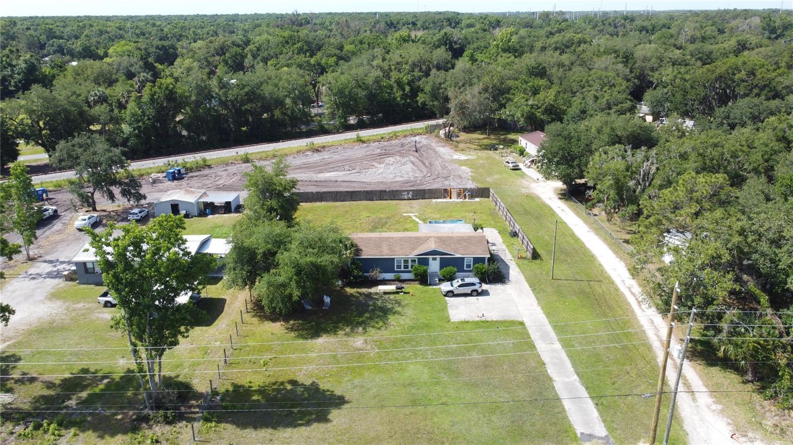 Amazing Portfolio Package Opportunity, must be sold together. 4 half acre lots with active residential rental properties on each property providing $88,800 in rental income and room for additional properties to double your rental income if you wish!  Three of the properties are side by side with just a small piece of land in between the 4th property.  These properties are currently zoned residential, the buyer could change the zoning to institutional with opportunity to potentially change to a hospital, education facility or government office.  6594 Osceola Polk Line Rd is a 3 bed 2 bath mobile home with 2,052 heated sq ft, this property was renovated in 2025, long term tenant paying $2400 a month, 6590 Osceola Polk Line Rd is a 3 bed 2 bath mobile home with 1,248 heated sq ft, this property was renovated in 2025, long term tenant paying $2000 a month, 6600 Osceola Polk Ln Rd is a 3 bed 2 bath mobile home with 2,107 heated sq ft, this property the tenants have lived at for 10 years currently paying $1500 a month and 6614 Osceola Polk Line is a 3 bed 2 bath mobile home with 1,104 heated sq ft, this property has been renovated and also has a large garage and workshop with tenants paying $1500 a month.  Each property has it’s own septic and well.  Tenants pay all utilities and are responsible for the lawn maintenance.   Fantastic opportunity for a 1031 exchange, investor or business owner, this is a prime location just minutes away from Disney, major highways and restaurants.