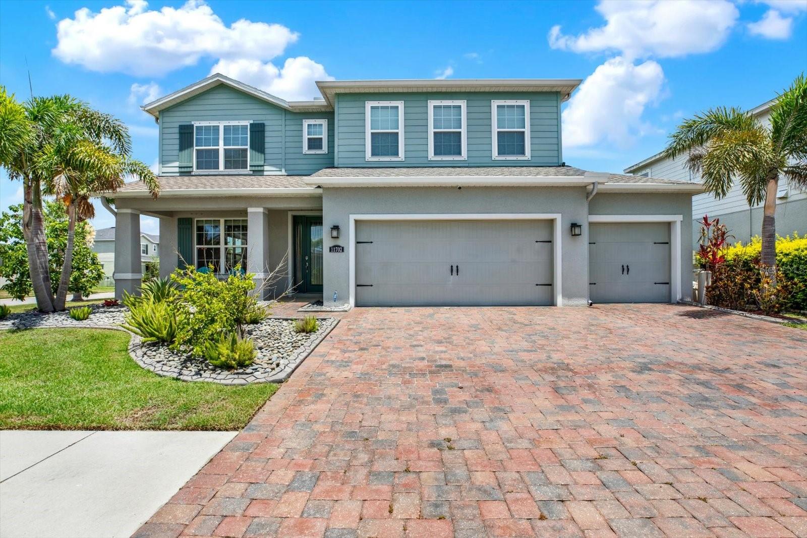 LUXURY LIVING MEETS BACKYARD RESORT PERFECTION | Welcome to a backyard paradise where resort-style living, elegant design, and the best of Lucaya Lake Club come together in spectacular fashion. Perfectly positioned on an oversized corner lot in one of Riverview’s most desirable gated, natural-gas communities, this impressive 5-bedroom, 3-bath, 3-car garage residence delivers the space, sophistication, and Florida lifestyle buyers dream about.

From the moment you arrive, the paver driveway, lush landscaping, and stately two-story curb appeal create an unforgettable first impression. Step inside to a bright, open-concept floor plan enhanced by crown molding, luxury wood-look tile, refined finishes, and generous living spaces designed for both everyday comfort and grand-scale entertaining.

The designer kitchen is the heart of the home, showcasing granite countertops, shaker cabinetry, stainless-steel appliances, an extra-large island with double sink, walk-in pantry, upgraded dinette hutch, and a seamless connection to the family room. A first-floor bedroom and full bath provide exceptional flexibility for guests, multigenerational living, or a private home office.

Upstairs, a spacious loft creates the perfect retreat for movie nights, gaming, homework, or quiet relaxation. The owner’s suite is a true sanctuary, featuring tray ceilings, dual walk-in closets, dual vanities, a soaking tub, and a separate walk-in shower. Three additional upstairs bedrooms, a full bath with double vanity, and a convenient second-floor laundry room complete the upper level.

Then step outside and discover the showstopper—a large screened-in backyard oasis with a sparkling saltwater pool and heated spa, covered lanai, paver pool deck, and fully equipped outdoor kitchen. Whether hosting weekend barbecues, enjoying evening swims, relaxing poolside, or entertaining under the Florida sky, this outdoor living space was designed to impress.

Additional upgrades include a tankless water heater, whole-home water softener/purifier, hurricane shutters, rain gutters, irrigation system, and more. Lucaya Lake Club presents an exceptional resort-style lifestyle centered around a beautiful 78-acre private lake with community boat ramp, fishing, kayaking, clubhouse, fitness center, zero-entry pool, splash pads, covered playground, sports field, sidewalks, private roads, and an engaging community atmosphere.

Ideally located near shopping, dining, entertainment, schools, medical services, and commuter routes, this home blends luxury, comfort, community, and lifestyle in one extraordinary Riverview address. This is not just a home—it is your private Florida retreat.