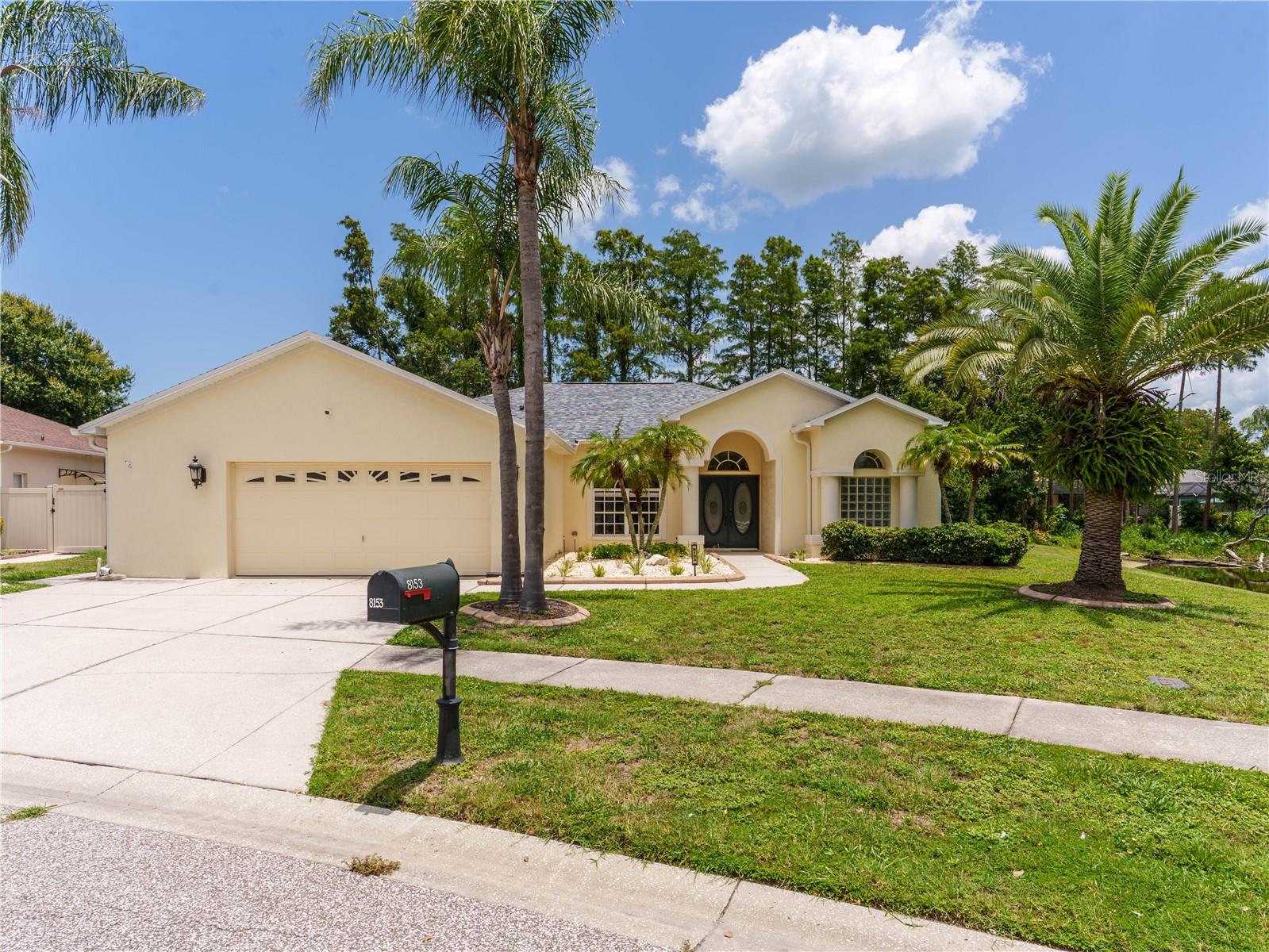 Welcome to your private Florida retreat in the desirable Sunset Lakes community! Situated on an oversized 1/3-acre waterfront lot with tranquil pond and conservation views, this beautifully maintained 4-bedroom, 2-bath home offers exceptional privacy with no rear neighbors.

The open split-bedroom floor plan features soaring ceilings, abundant natural light, and spacious living areas that flow seamlessly to the screened lanai. Relax or entertain in your backyard oasis featuring a saltwater pool, heated spa, and newly coated epoxy flake patio overlooking peaceful water and preserve views. The saltwater system provides low-maintenance ownership and can easily be converted to a traditional chlorine system if desired.

The spacious kitchen offers ample cabinetry, generous workspace, and a breakfast nook with backyard views. An oversized 2.5-car garage with dedicated workshop space provides plenty of room for vehicles, storage, and hobbies.

Thoughtful upgrades include a brand-new 12 kW DuroMax dual-fuel whole-home generator, fully updated irrigation system, mature tropical landscaping, and a solar energy system that has helped keep electric costs exceptionally low. A whole-home security system with monitored entry points and seven exterior cameras provides 360-degree coverage for added peace of mind.

Conveniently located near shopping, dining, medical facilities, parks, golf, Gulf beaches, and the Veterans Expressway, this home offers the perfect combination of waterfront living, privacy, energy efficiency, and premium upgrades. Schedule your private showing today!