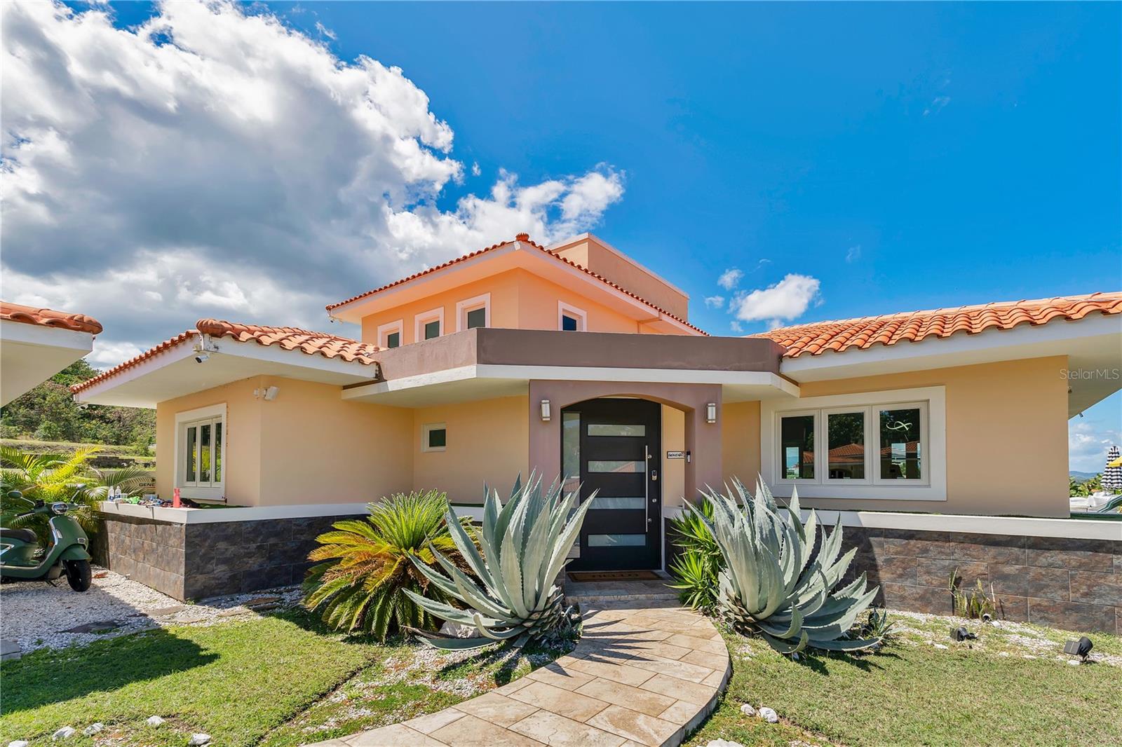 Elegant Retreat at The Views, Palmas del Mar – Humacao, Puerto Rico
Discover serene Caribbean living in this stunning 2-story home at The Views, Palmas del Mar. Perfect for families, couples, or nomadic workers seeking a peaceful space to live, work, and retreat, this residence offers spectacular views of the Caribbean Sea and an open, inviting layout.
With 4 bedrooms, 3.5 baths, and generous storage throughout, the spacious design flows seamlessly from the main living areas to the backyard and pool terrace — ideal for hosting gatherings or simply unwinding in your private oasis.

Palmas del Mar offers an exceptional lifestyle, featuring a private bilingual school, a lively farmers market, 
a Casino Hotel with world-class facilities, a Marina for boat enthusiasts, a variety of excellent restaurants, 
and a top-notch golf course for lovers of the sport.

All this, just a short drive from the vibrant cities of San Juan, Caguas, and Fajardo, 
blending the best of quiet retreat and convenient access to urban energy.

Live, work, and relax surrounded by beauty, community, and comfort.