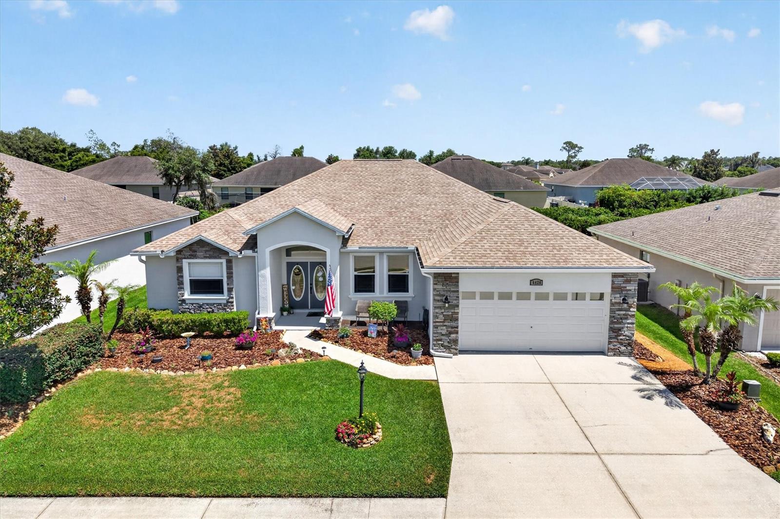 Hallam Preserve is one of Lakeland's most coveted addresses and this former model home in the gated Evergreen Park is one of its finest offerings. This immaculate 4BR/3BA home offers 2,627 sq ft of thoughtfully designed living space and has been meticulously maintained  featuring a brand new roof (2025), new AC (2025), freshly painted interior (2024), and updated exterior paint (2023).

Step through the leaded glass double front doors into an elegant foyer that flows seamlessly into the expansive formal living room. The formal dining room, framed by architectural pillars and finished with crown molding, sets a tone that carries throughout the home. The chef's kitchen is a true showstopper,  featuring an abundance of rich wood cabinetry, gleaming granite countertops, stainless steel appliances, a walk-in pantry, and a breakfast bar that opens to both the family room and breakfast nook, making it ideal for everyday living and entertaining alike.

The spacious primary suite is a private retreat, while a second bedroom with its own ensuite bath offers the flexibility of a true guest suite or second master — perfect for multigenerational living or visiting family. The split floor plan provides privacy and functionality throughout.
Conveniently located minutes from shopping, dining, and with easy access to I-4 between Tampa and Orlando. Schedule your private showing today!