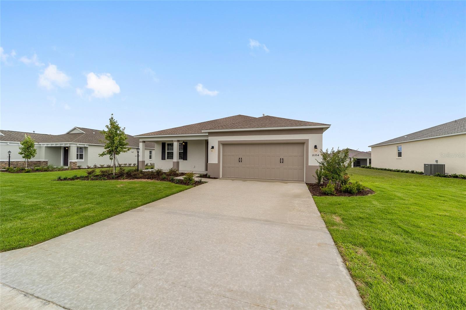 Move-in ready and thoughtfully designed, this newly built Wisteria model in the desirable Longleaf Ridge neighborhood offers the perfect blend of style, comfort, and low-maintenance living. Featuring 3 bedrooms, 2 bathrooms, a 2-car garage, and an open-concept great room, this home is ideal for both everyday living and entertaining. Luxury vinyl plank flooring flows throughout the entire home with no carpet, creating a seamless, modern look. The well-appointed kitchen showcases granite countertops, designer wood cabinetry, and ample workspace, opening effortlessly to the spacious living and dining areas. The private primary suite provides a relaxing retreat, while two additional bedrooms offer flexibility for guests, hobbies, or a home office. A dedicated laundry suite adds everyday convenience. Located in the sought-after Weybourne Landing community by On Top of the World Communities, residents enjoy exceptional amenities including a clubhouse, resort-style pool, pickleball courts, and a vibrant active adult lifestyle. Don't miss your chance to make this beautiful new home your own.