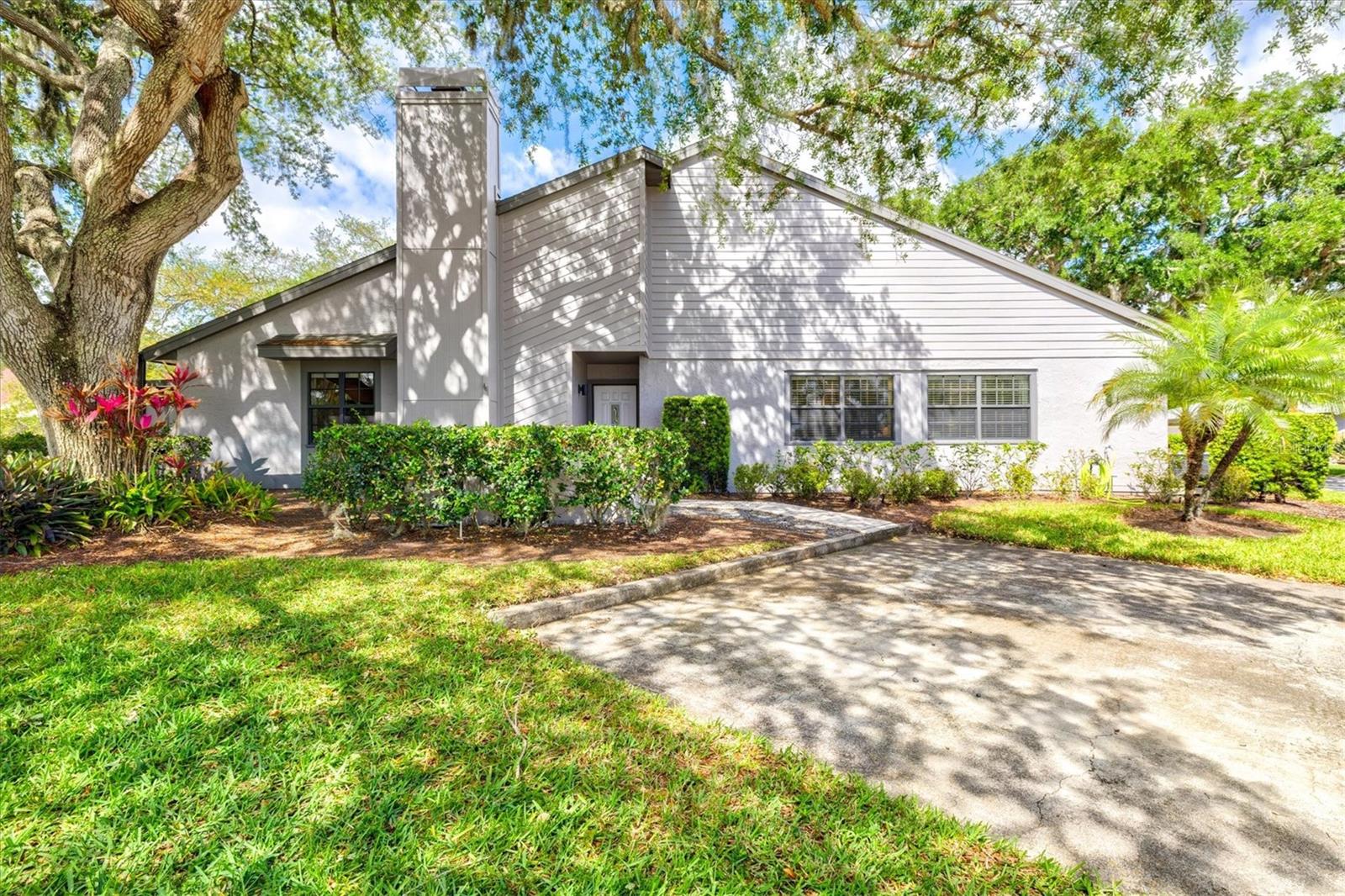 $70K PRICE REDUCTION!! Priced to Sell!! Welcome to one of the most special residences in the serene community of Beekman Lakes, conveniently located just minutes from both downtown Sarasota and the University corridor. Homes in this sought after maintenance-free community are hard to come by and this one should check all your boxes with impressive updates including the Big Ticket items. NEW ROOF 2024, NEW AC 2022, NEW SCREEN ENCLOSED LANAI 2022, NEW APPLIANCES 2023-2026. The oversized windows and vaulted ceilings create an airy and voluminous feeling not to be outdone by the gorgeous lake views to the South where endless species of birds take refuge. The house is anchored by a well appointed chefs kitchen with floating island offering abundant prep space and seating. A built in beverage fridge and separate dedicated dining room with built in buffet make this house very well suited for year round living and entertaining alike. All three bedrooms are very generously sized and the primary suite offers his and her closets and sinks as well as extra storage space in the master bathroom. A glass enclosed atrium off the dining room offers a unique opportunity for artistic expression or additional storage. Come see for yourself and fall in love with this very unique slice of paradise. Note the HOA fee covers internet, landscaping, irrigation, exterior paint, property insurance, pest control and common amenities including the heated pool and spa.