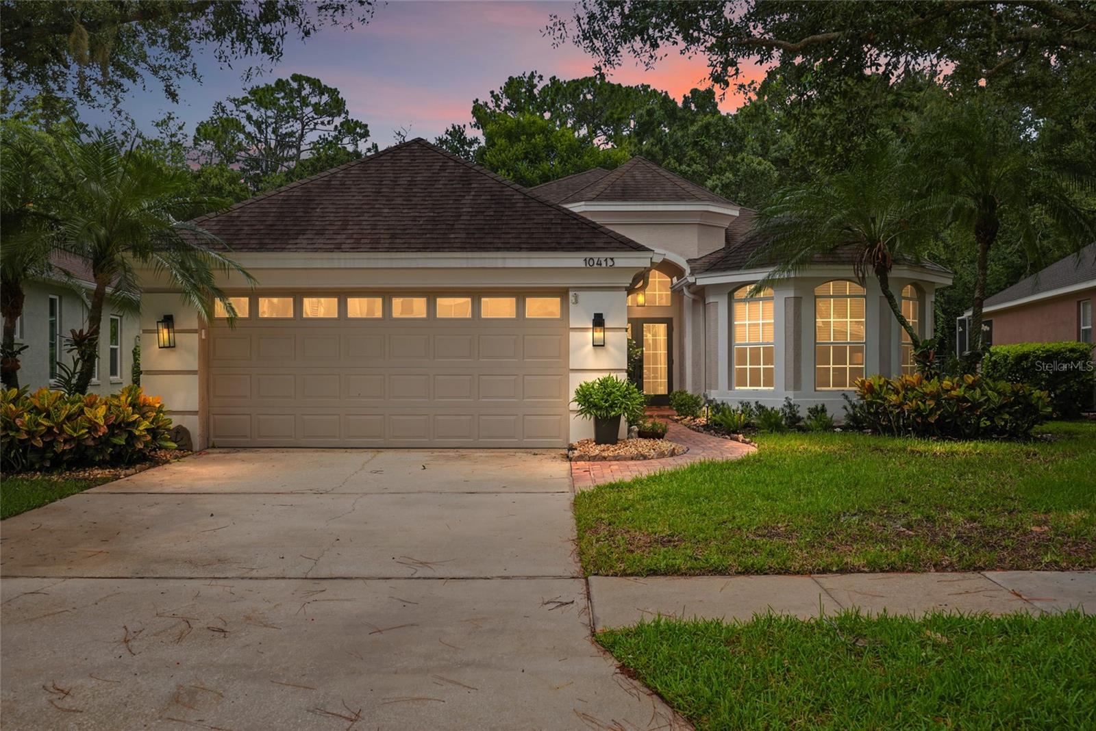 Beautifully updated throughout, this exceptional residence located in The Greens features 3 spacious bedrooms PLUS A BONUS ROOM, and a seamless blend of timeless elegance and modern comfort. Every detail has been carefully curated, creating a home that is as functional as it is beautiful. From the moment you step inside, you'll appreciate the open-concept floor plan, highlighted by soaring ceilings, dramatic barrel ceiling architecture, deep crown molding, and custom built-in shelving that creates a stunning focal point in the living room. Natural light pours into the living space through oversized three-panel sliders overlooking the beautifully designed pool area. At the heart of the home is the renovated chef's kitchen featuring all-stainless-steel appliances, 42" wood cabinetry, quartz countertops, a gas range, farmhouse sink, built-in wine fridge, and designer finishes perfect for entertaining. Just beyond the kitchen, you'll find a charming coffee bar and flex space that offers additional storage, a beverage station, or the perfect spot for a home workspace. And a charming breakfast nook provides the perfect spot to enjoy your morning coffee while taking in peaceful views of the sparkling pool and tranquil conservation backdrop. Designed for both everyday comfort and entertaining, the spacious dining and living areas seamlessly transition to your private backyard oasis. Step outside to an expansive screened and beautifully paved lanai featuring a luxurious heated pool with an elegant waterfall feature, beautifully redesigned landscaping, and updated fencing - all overlooking peaceful conservation views that create a true sense of serenity. The private primary suite offers a spacious retreat with dual walk-in closets and a generous spa-inspired bathroom complete with dual vanities and abundant storage, featuring a spacious walk-in shower, a private water closet, and a jetted soaking tub. Two additional bedrooms and a versatile bonus room provide the flexibility to accommodate a home office, den, or 4th bedroom. A thoughtfully designed laundry room with the washer and dryer included, built-in shelving, and two spacious storage closets add everyday convenience. Additional highlights include a spacious two-car garage equipped with a utility sink and water softener, newly updated landscaping in both the front and backyard, fresh paint, new exterior front yard lighting, new fans and fixtures throughout, inside and outdoor surround sound system, newer pool heater, and more! This home has been meticulously maintained and thoughtfully cared for, with major systems updated and serviced to provide peace of mind for its next owner. Located within the 24-hour guard gated community of The Greens at Westchase, residents enjoy exclusive walking paths, access to the Westchase Golf Course, and low HOA fees. No flood insurance required. Access to highly rated schools. Beyond the gates, Westchase offers an unmatched lifestyle with community pools, tennis courts, parks, trails, the Westchase Golf Club, and the vibrant West Park Village featuring boutique shopping, restaurants, and neighborhood events. Conveniently located just minutes from Tampa International Airport, Downtown Tampa, the Veterans Expressway, this exceptional home offers luxury, convenience, and an unbeatable lifestyle.