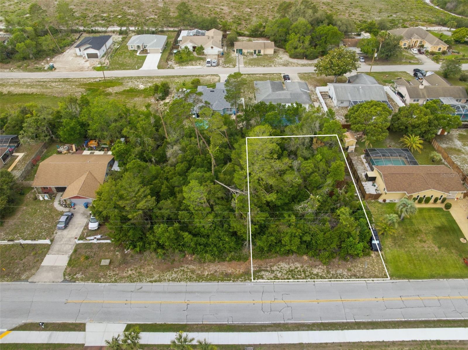 Opportunity knocks in the heart of Florida’s Nature Coast with this nearly ¼-acre vacant lot located on Spring Hill’s desirable west side. Whether you’re a builder looking for your next opportunity, an investor searching for future potential, or a buyer ready to design a custom Florida dream home, this property offers flexibility, location, and potential all in one. Even better? The neighboring lot is also available for purchase, creating a rare opportunity to secure two side-by-side sites for expanded building options, multi-home development, or added privacy.

Surrounded by established homes while still offering a peaceful, tucked-away feel, this property is ideally positioned for those who appreciate Spring Hill’s relaxed coastal lifestyle and growing demand for new construction. Conveniently located just off US-19 with easy access to the Suncoast Parkway, commuting to Tampa and surrounding areas remains simple while still enjoying the quieter charm Hernando County is known for.

Outdoor lovers will appreciate being just minutes from some of the Nature Coast’s most iconic destinations including Weeki Wachee Springs State Park, famous for its crystal-clear spring waters, kayaking, paddleboarding, river boat tours, and legendary live mermaid shows. Spend weekends floating down the Weeki Wachee River, exploring nearby preserves, or enjoying waterfront dining and boating in Hernando Beach.

You’re also a short drive from Pine Island Beach Park, Hernando County’s only public beach offering Gulf sunsets, fishing, kayaking, and a true Old Florida atmosphere locals love. Nearby nature preserves, hiking trails, and wildlife areas provide endless opportunities to enjoy Florida’s outdoor lifestyle year-round.

With shopping, dining, healthcare, schools, and everyday conveniences all nearby, this location perfectly balances peaceful living with accessibility. Buy one lot or take advantage of the rare opportunity to purchase both side-by-side parcels and maximize the possibilities.