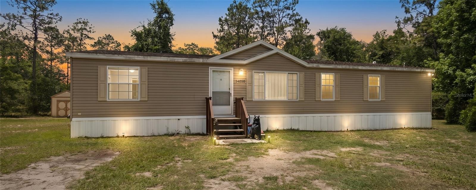 Location, location, location! Owner is motivated to sell and move on to a new career! Enjoy the country view from the front picture window of this spacious 2005 manufactured home featuring an open floor plan with 3 bedrooms and 2 baths.  The bright Kitchen opens to living room and dining area.  Tucked away next to the dining area is a cozy family room with a woodburning fireplace.  Enter the laundry room with washer and dryer from the kitchen or from the second bath.  Two bedrooms with generous closet space located down the short hallway.  No wasted space in this home. The primary suite affords privacy on the other end of the home with its own ensuite bath. Lots of square footage for the active family! 2nd set manufactured home with roof replaced at time of relocation (8 years old) sitting on 1.25 acres with a 10 x20 shed. New well motor replaced 5/13/26. Lender with a program to finance this home available.  Seller is open to negotiate concessions.