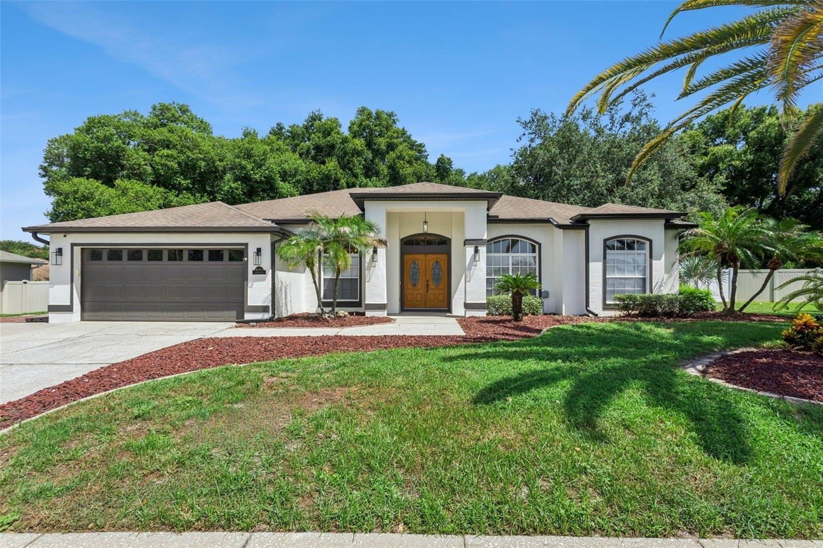 APPRAISAL JUST COMPLETED! Welcome to 16413 Arrowhead Trail, a tastefully updated 4-bedroom, 3-bathroom home in the established community of Arrowhead Estates. Situated on an oversized .36-acre lot, this home also features a versatile bonus room that can easily serve as a 5th bedroom, home office, media room, or flex space.

Inside, you'll find a desirable split floor plan with all-new luxury vinyl flooring throughout, fresh interior finishes, and no carpet. The completely remodeled kitchen is the centerpiece of the home, featuring custom cabinetry extending to the ceiling, quartz countertops, a large center island with seating for three, a seamless full-height quartz backsplash with hidden under-cabinet outlets, and a suite of stainless steel appliances.

The spacious primary suite features a tastefully renovated ensuite bathroom with a freestanding soaking tub, walk-in shower, dual quartz vanities, and updated finishes. Two additional renovated bathrooms complete the home's extensive updates.

Additional improvements include a new HVAC system, new fencing, and all-new luxury vinyl flooring throughout.

Step outside to enjoy both a screened lanai and a separate screened patio overlooking the fully fenced backyard. With more than one-third of an acre, there's plenty of room to add a pool, outdoor kitchen, play area, or create your own private outdoor living space. The property also includes a detached shed that can be used as a workshop or additional storage.

Located just minutes from Florida's Turnpike, you'll enjoy easy access to Downtown Orlando, Winter Garden, Clermont, and the surrounding Central Florida area. Costco, shopping, dining, and everyday conveniences are all nearby, while Lake Louisa State Park is just a short drive away, offering hiking, kayaking, camping, fishing, and miles of scenic trails. Schedule your private showing today!