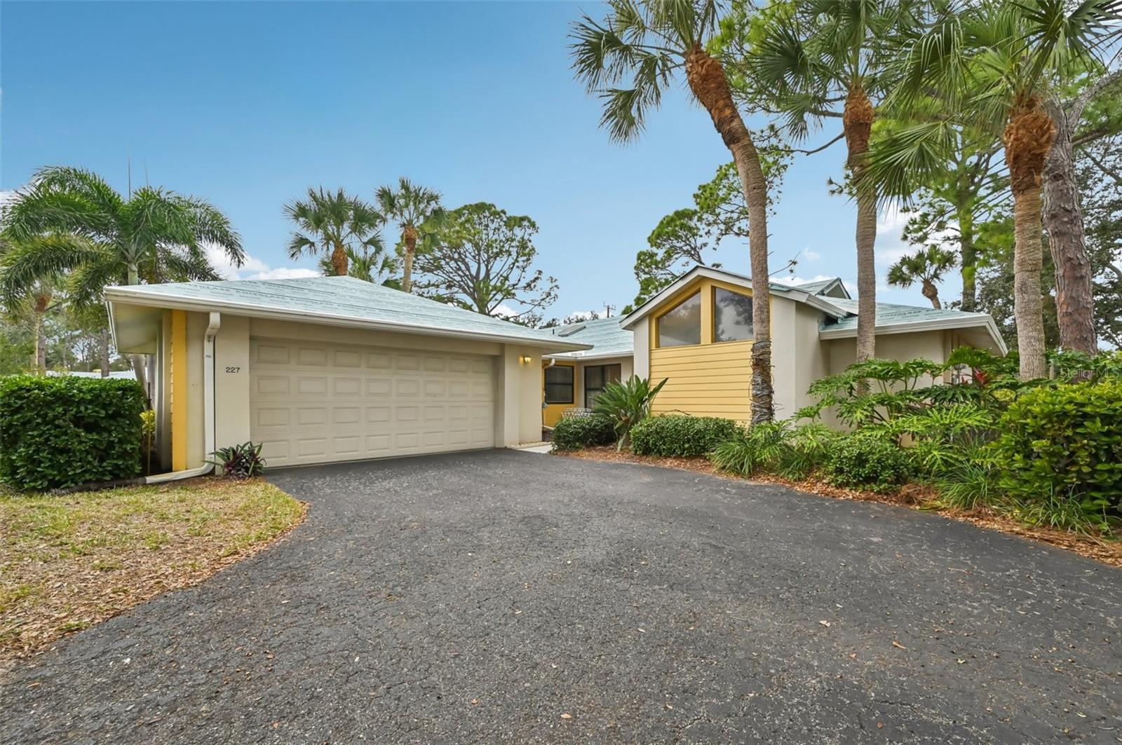 One or more photo(s) has been virtually staged. Welcome to this delightful villa, perfectly situated on a picturesque street lined with a canopy of mature oak trees. This home offers a spacious and versatile floor plan, featuring two primary suites, two full baths, and a convenient two-car garage. 
Step inside to a welcoming foyer that leads into a bright living room with soaring cathedral ceilings. The generous bonus room provides the ideal space for a home office, den, or creative retreat. At the rear of the house, the sunlit Florida Room invites relaxation and enjoyment year-round. 
The updated kitchen is a chef’s dream, boasting solid surface countertops, a stylish tile backsplash, raised wood panel cabinetry with pull-out shelves, and modern stainless steel appliances. NEW refrigerator will please the cook of the house.  Recent upgrades include a newer AC unit has recently been serviced and an updated electrical panel (2014), and a NEW hot water heater ensuring comfort and peace of mind. Association is currently installing new metal roofs throughout the community adding beauty and safety for many years to come with NO assessment. 

Residents of Myrtle Trace enjoy a vibrant community lifestyle, with access to a nearby clubhouse hosting a variety of activities and a heated community pool. For those seeking even more amenities, an optional membership to The Plantation Golf & Country Club is available, offering TWO 18-hole championship golf courses, a fitness center, tennis courts, a heated Jr Olympic-size pool, diverse dining options, and a wide range of activities.