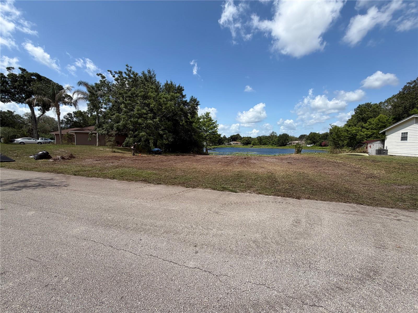 Lakefront Vacant Lot – 257 Lake Ln, DeBary, Florida 32713

Build Your Dream Home on Lake Bonita

Don't miss this rare opportunity to own a stunning lakefront homesite in one of DeBary's most serene neighborhoods. Located on a quiet, paved street and surrounded by well-maintained homes, this 9112 sqft. as shown on the survey on Lake Bonita offers the perfect canvas for your custom dream home.

The lot gently slopes toward the water, creating an ideal setting for elevated architectural designs — think soaring decks and floor-to-ceiling windows — to capture breathtaking lake views. With the parcel backing directly up to Lake Bonita, you'll enjoy exceptional privacy and natural beauty right in your own backyard.
The surrounding area is experiencing exciting growth, with new, larger homes being built nearby — a strong indicator of rising property values and long-term investment potential. A wetland delineation has already been completed, helping to streamline your due diligence and get you one step closer to breaking ground.
Opportunities like this don't last. Secure your piece of lakefront paradise today.

Highlights:
9112 sq. ft. lakefront lot on Lake Bonita
Located on a paved street in an established DeBary neighborhood
Gentle slope ideal for elevated home designs and water views
Wetland delineation already completed
Growing area with new construction nearby