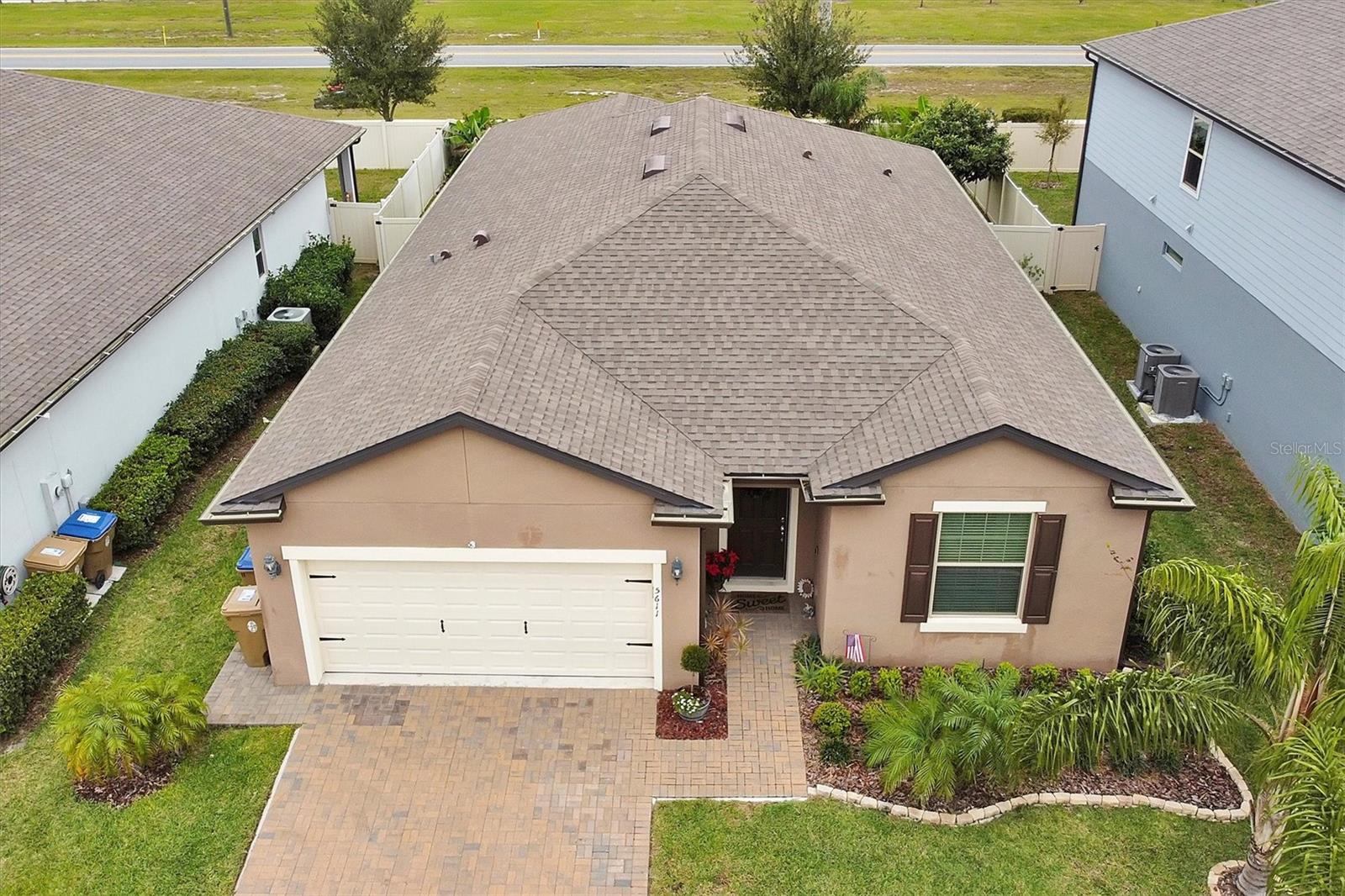Move in ready home in St Cloud just a few minutes away from Lake Nona! This immaculate home has a modern, open floor plan with 3 bedrooms and a flex room/den that would be perfect for an office, nursery, playroom, man-cave or she-shed. A barn door has been added to this room for privacy and appeal. Laminate flooring added to the den, master bedroom and bath. Tile flooring throughout the rest of the home except for the guest bedrooms that have carpet. Even the garage is immaculate with epoxy flooring and a water filtration system. Granite counter tops are in the kitchen and the bathrooms. The kitchen also has a huge island and stainless appliances. This home also has a large laundry room with a mudroom just before it. The master shower has an upgraded glass door, tile, large niche, and bench. Back yard is fenced with beige vinyl and has a large, screened patio. The community has its own pool, playground and dog area. Only 6 miles to Hwy 417. Get anywhere in Central, FL in minutes! The Orlando VA Hospital is only 5.5 miles away along with Nemours Children’s Hospital, Boxi Park and so much more! Publix Super Market at Lake Nona Plaza is only 3 miles away! St Cloud Lakefront Park is only 10 miles away and contains a 143 boat-slip marina, banquet hall, bike path, boat ramp, family picnic pavilions, fishing pier, performing arts pavilion, picnic tables, playground, restrooms, sand beach, splash pad, volleyball court and Crabby Bill's Restaurant on the lake! Enjoy world class bass fishing and boating. Yard maintenance included.