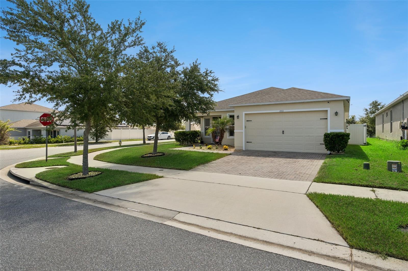 Welcome to this stunning 4 bedroom, 2 bath home situated on a spacious corner. lot in the highly sought after Eagle Pointe Community.  Featuring an open concept floor plan, this home is perfect for everyday living and entertaining.  The modern kitchen has stainless Steele appliances ,plenty of cabinet space, and a seamless flow into the living and dining rooms.  the spacious primary suite offers a relaxing retreat with luxury vinyl flooring, a beautiful ensuite bathroom, and a generous walk in closet.  three additional bedrooms provide plenty of space for family, or a home office.  A designated inside laundry room is convenient, while the covered lanai with extended pavers , gives plenty of room to enjoy the Florida weather.  Step outside to a fully vinyl fenced in backyard, offering privacy and plenty of room.  Conveniently located  near attractions , shopping and dining. Don't miss the opportunity to make this property your new home.