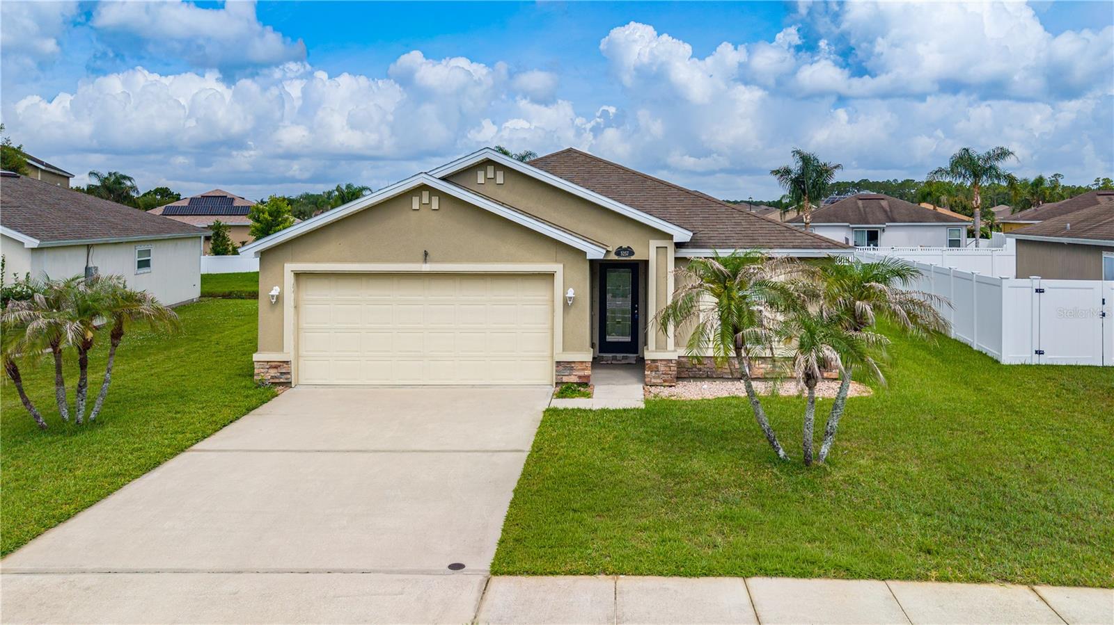 Welcome to Port Orange Plantation, one of our areas most desirable communities, conveniently located adjacent to the mega Coraci Sports Complex Park. This well-maintained 2011 built home, offers 1,520 square feet of comfortable living space with 3 bedrooms, 2 bathrooms, and a 2-car garage. Inside, you'll find an open and inviting floor plan featuring vaulted ceilings, tile flooring throughout the main living areas, 42-inch maple cabinetry, and solid-surface countertops that provide both style and functionality. The spacious primary suite and split-bedroom layout offers privacy and comfort for a family. Step outside and enjoy peaceful canal views from your backyard while benefiting from a full irrigation system to keep the landscaping looking its best year-round. Ideally situated near parks, shopping, dining, top-rated schools, and major roadways, this move-in-ready home combines quality construction, thoughtful upgrades, and a fantastic location.